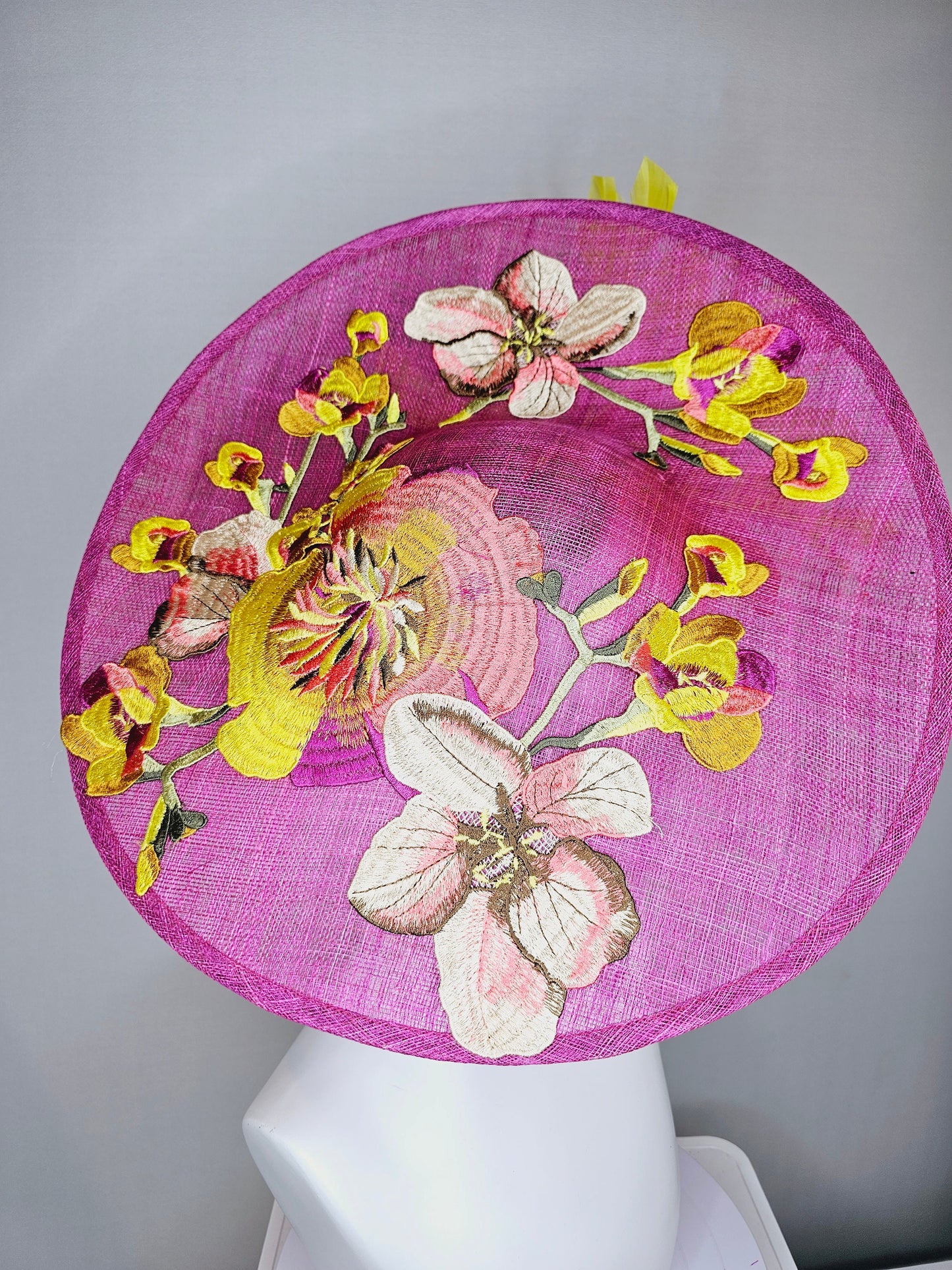 kentucky derby hat fascinator mulberry purple sinamay saucer with yellow coral purple pink embroidered flowers and peach yellow feathers