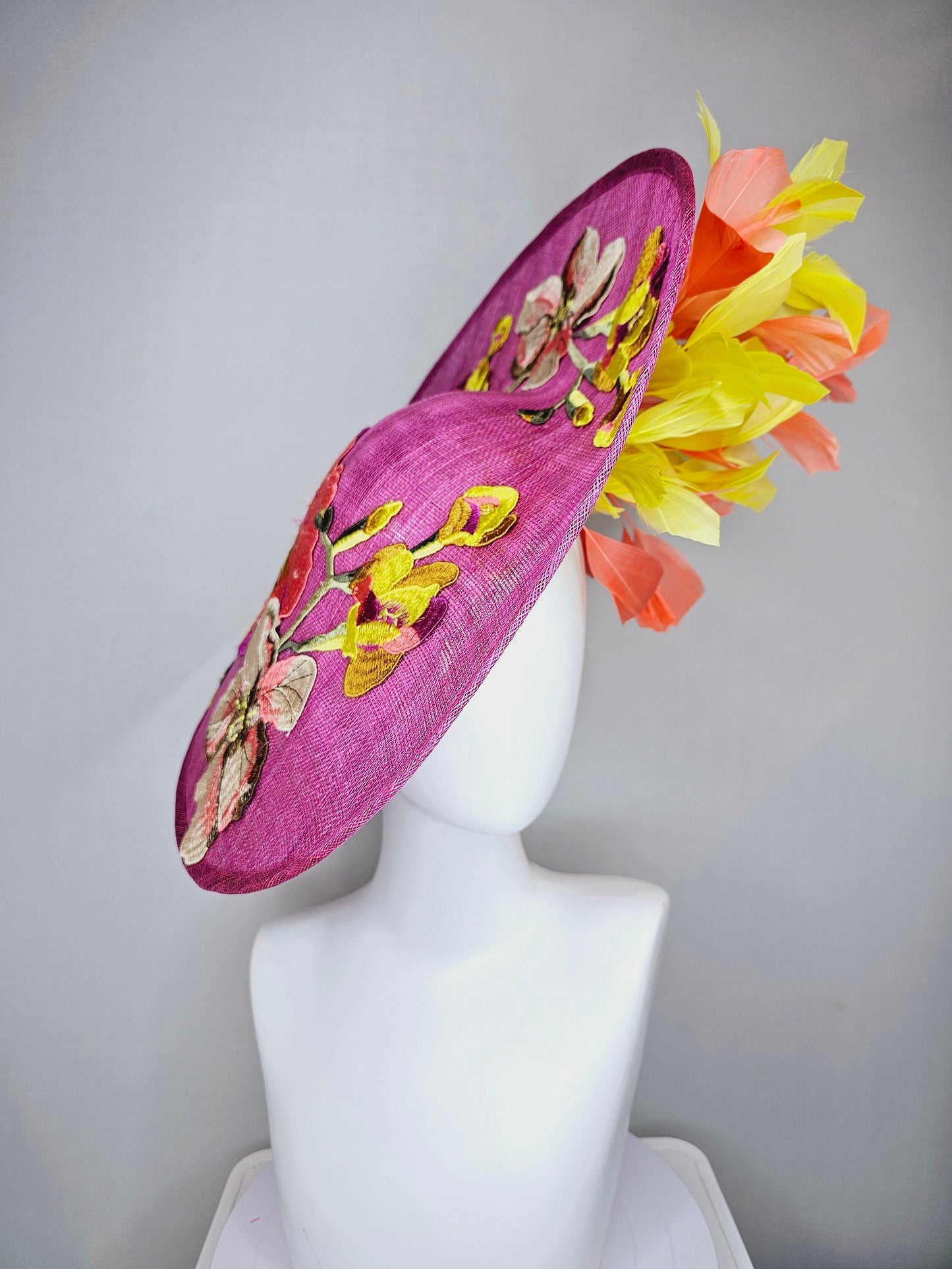 kentucky derby hat fascinator mulberry purple sinamay saucer with yellow coral purple pink embroidered flowers and peach yellow feathers