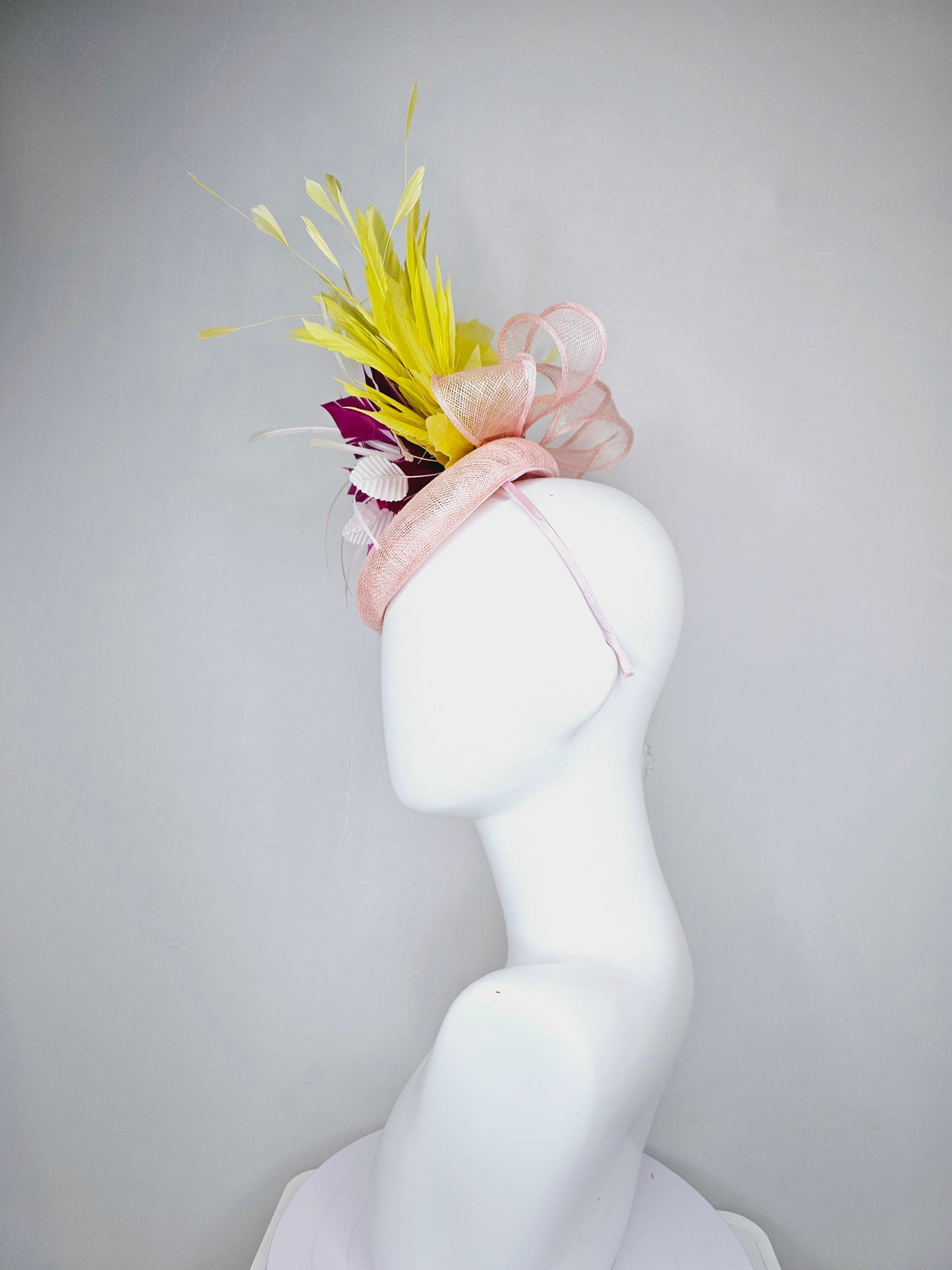 kentucky derby hat fascinator light pink sinamay with large fuchsia pink and white feather flowers,and branching bright yellow feathers