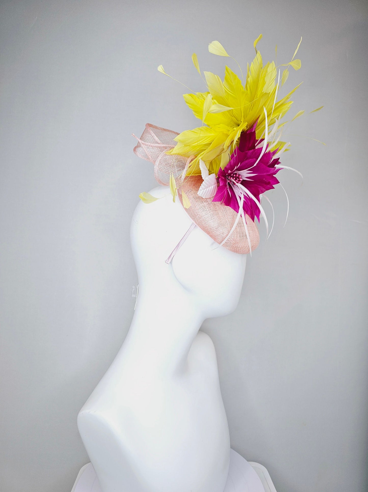 kentucky derby hat fascinator light pink sinamay with large fuchsia pink and white feather flowers,and branching bright yellow feathers