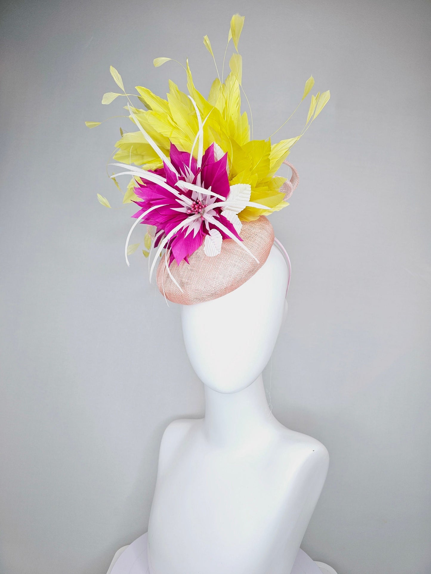 kentucky derby hat fascinator light pink sinamay with large fuchsia pink and white feather flowers,and branching bright yellow feathers