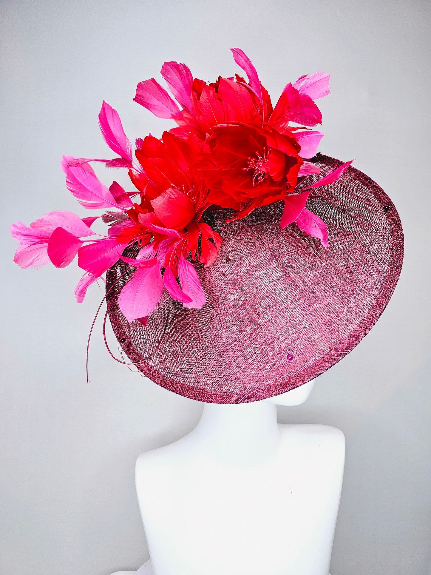 kentucky derby hat fascinator burgundy wine sinamay saucer with matching netting with sequin and red flower feather and hot pink feathers