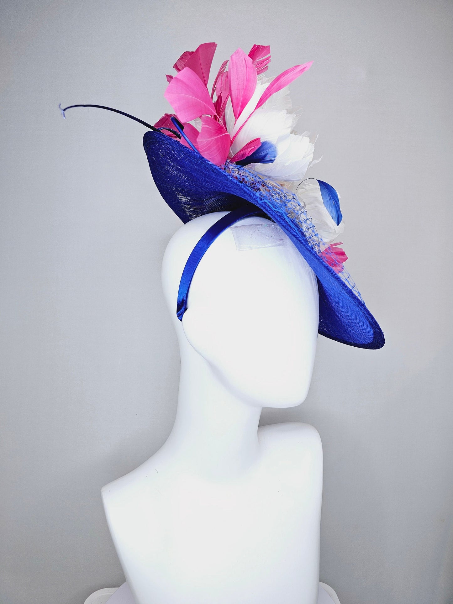 kentucky derby hat fascinator royal blue saucer with netting and sequin,white fluffy feather flowers and branching pink feathers