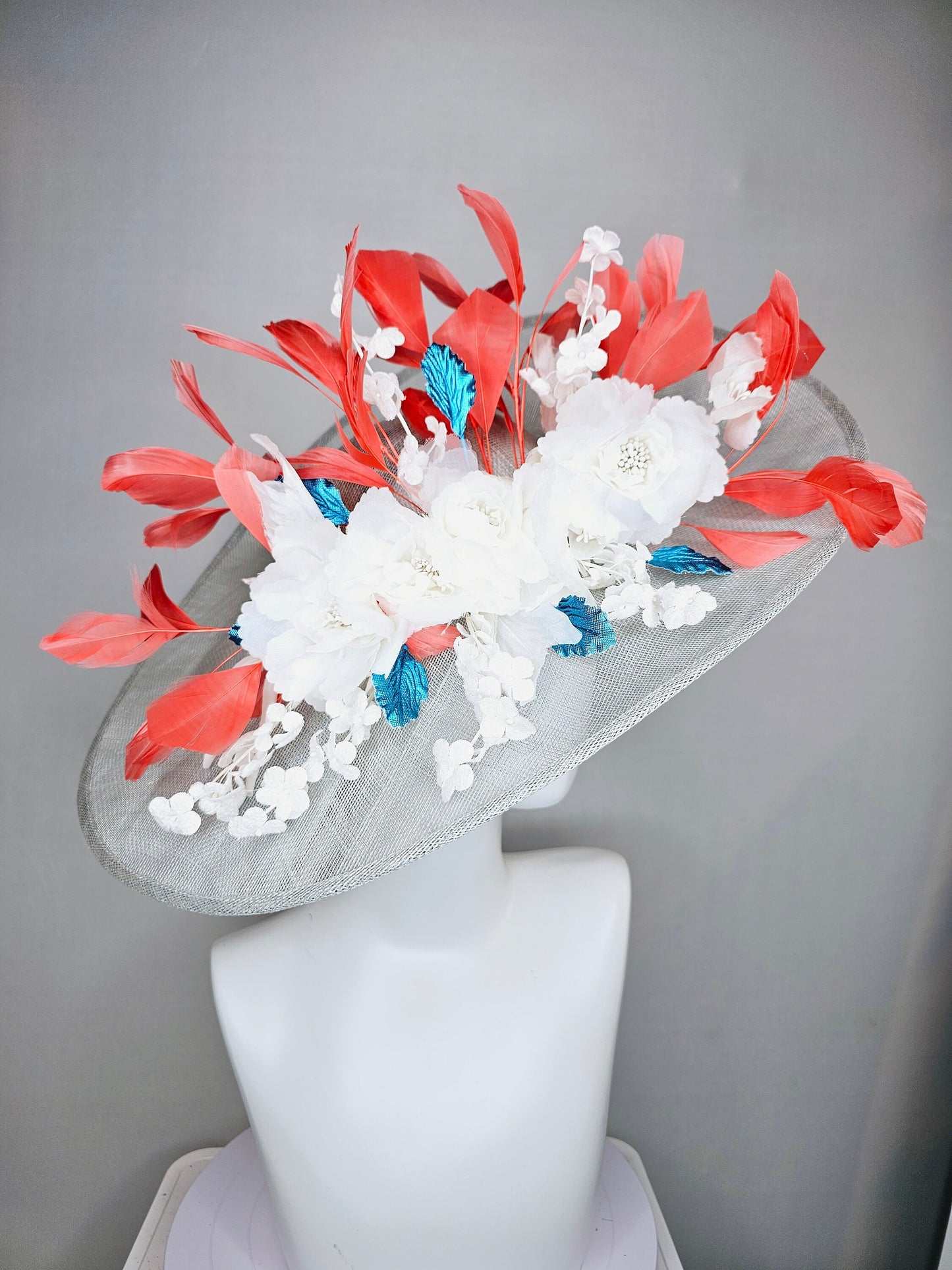 kentucky derby hat large wide brim sinamay gray hat with white ivory organza flowers and blue leaves with coral orange branching feathers