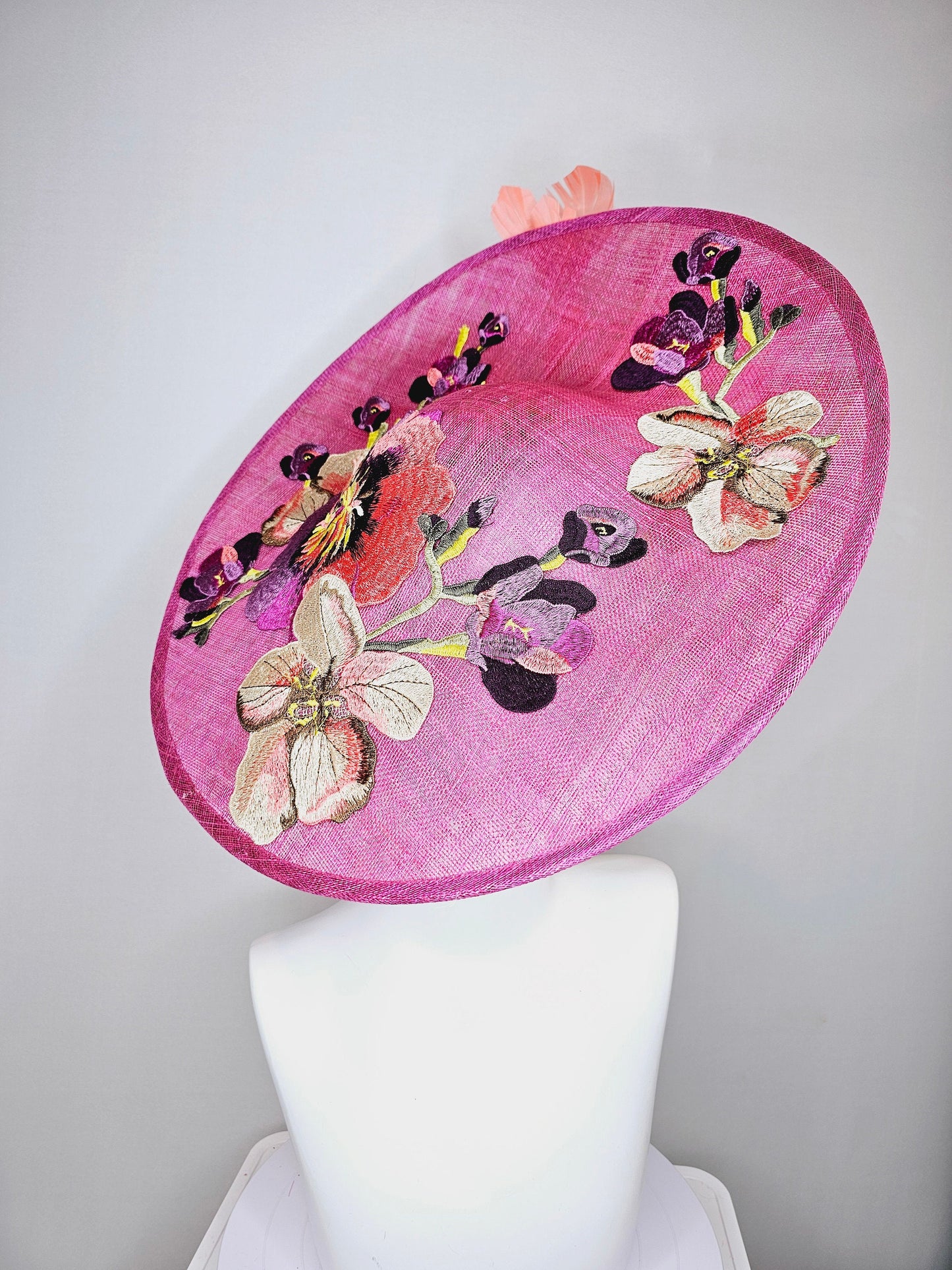 kentucky derby hat fascinator large pink sinamay saucer with yellow coral purple pink ivory embroidered flowers and orange yellow feathers