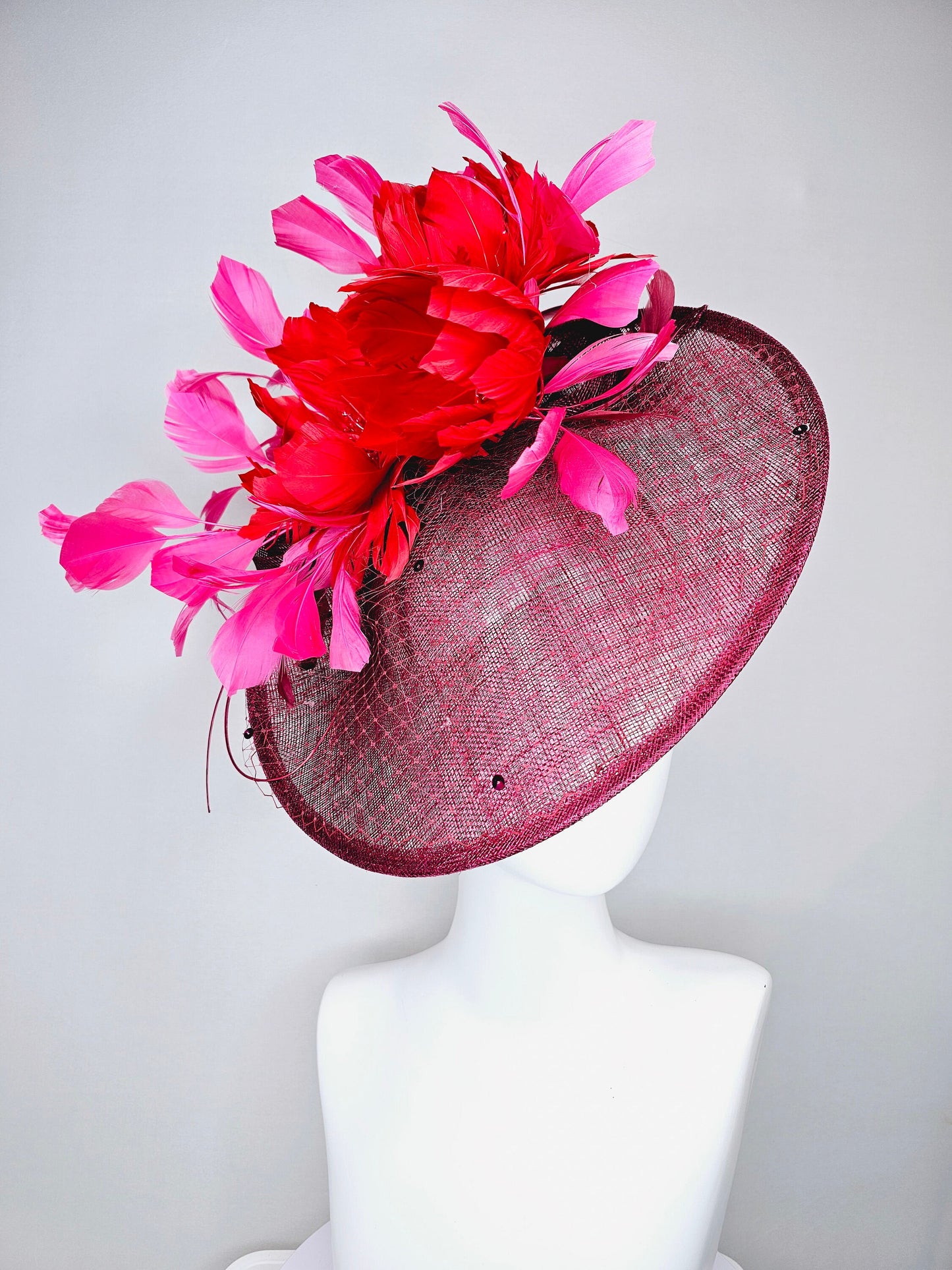 kentucky derby hat fascinator burgundy wine sinamay saucer with matching netting with sequin and red flower feather and hot pink feathers