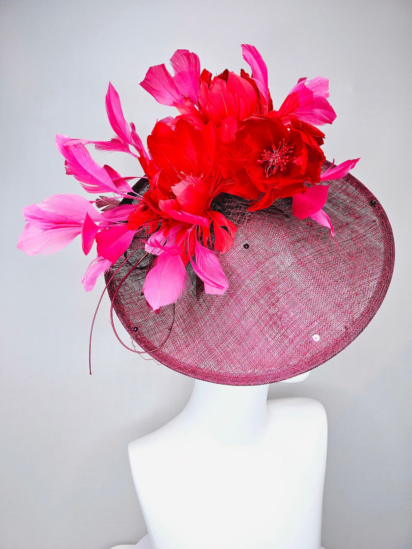 kentucky derby hat fascinator burgundy wine sinamay saucer with matching netting with sequin and red flower feather and hot pink feathers