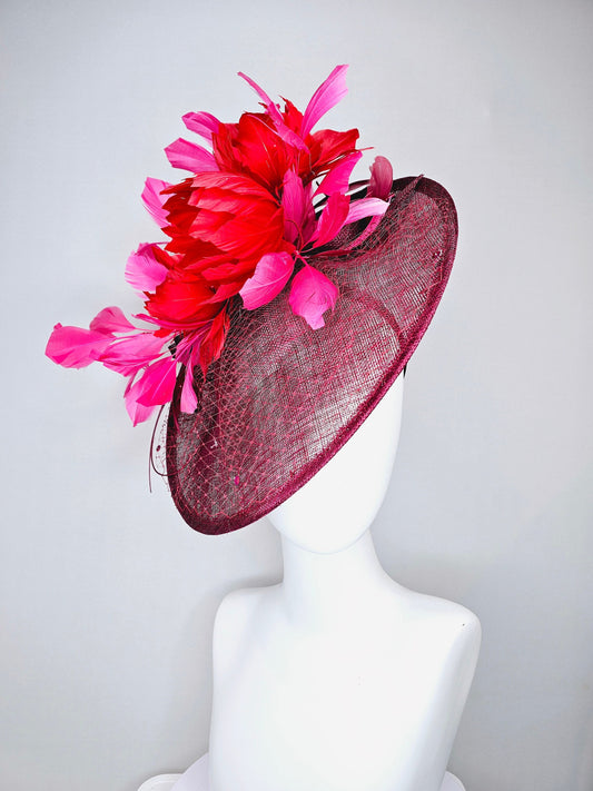 kentucky derby hat fascinator burgundy wine sinamay saucer with matching netting with sequin and red flower feather and hot pink feathers