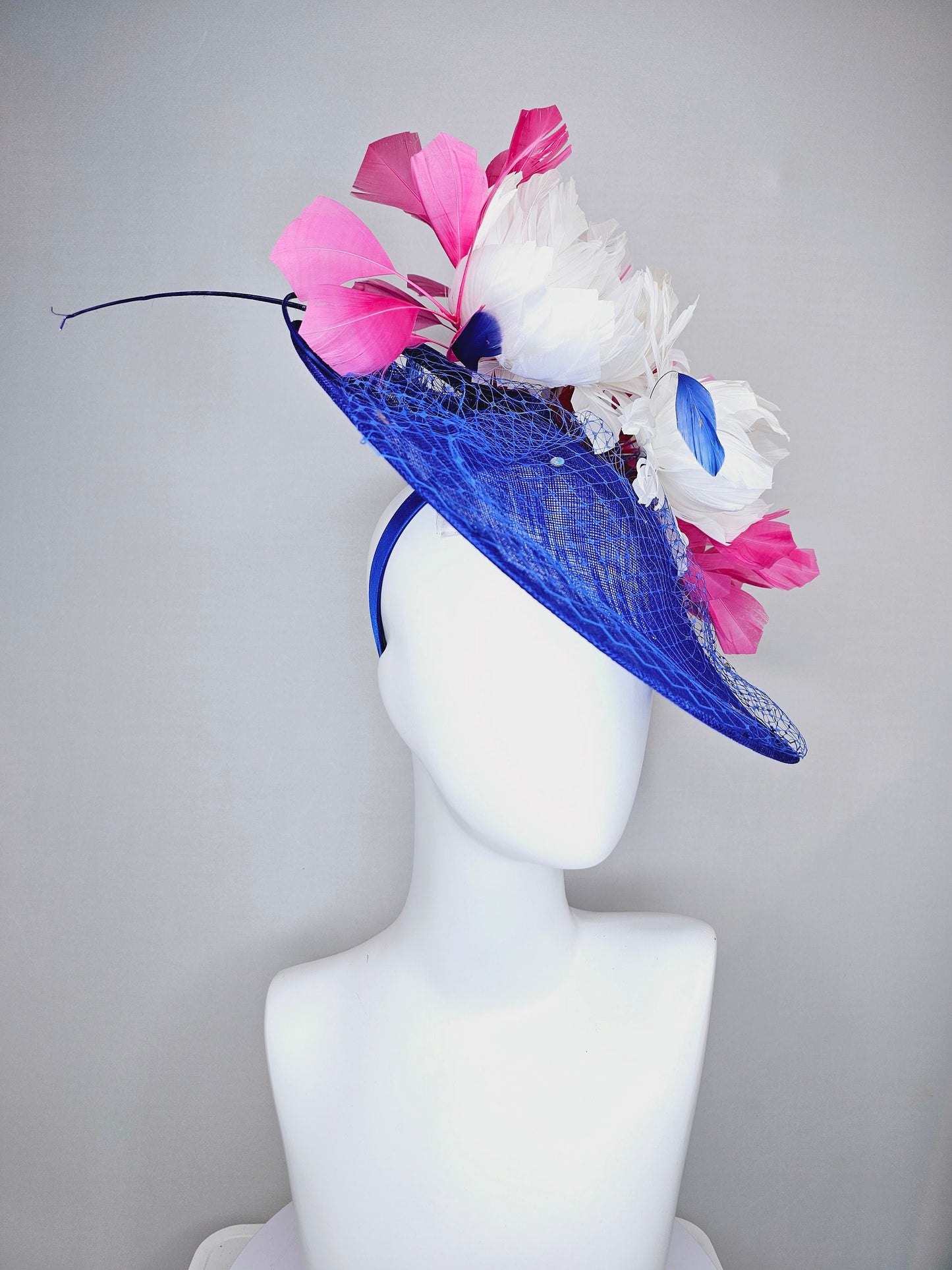 kentucky derby hat fascinator royal blue saucer with netting and sequin,white fluffy feather flowers and branching pink feathers