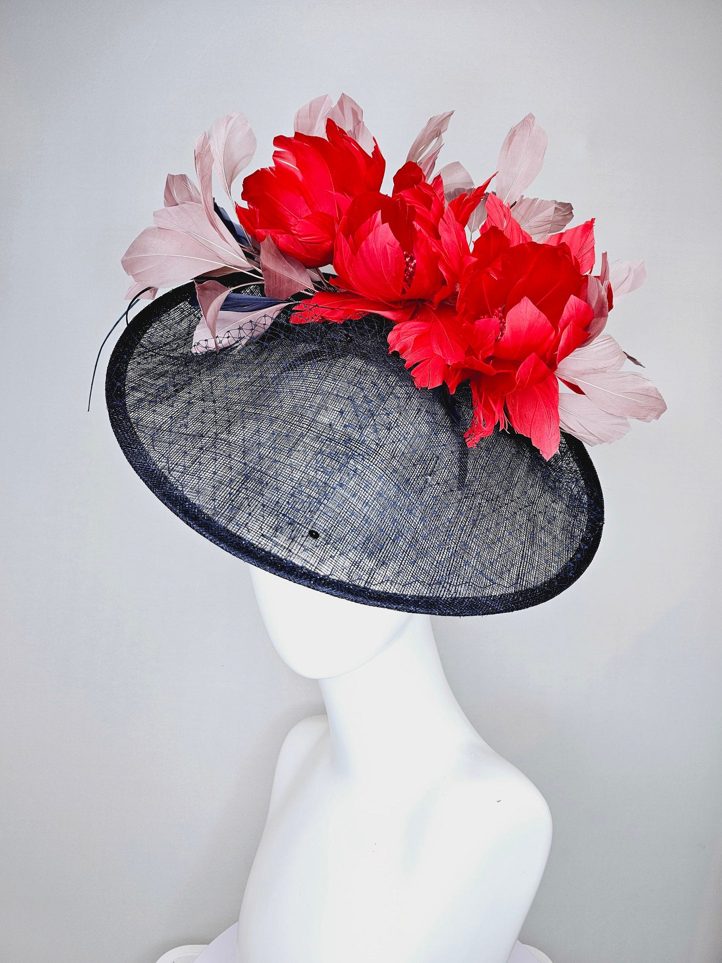 kentucky derby hat fascinator midnight navy blue sinamay saucer with netting and sequin,red fluffy feather flowers and blush taupe feathers