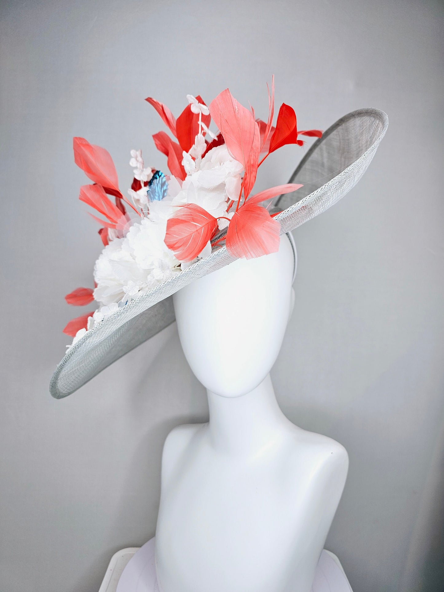 kentucky derby hat large wide brim sinamay gray hat with white ivory organza flowers and blue leaves with coral orange branching feathers