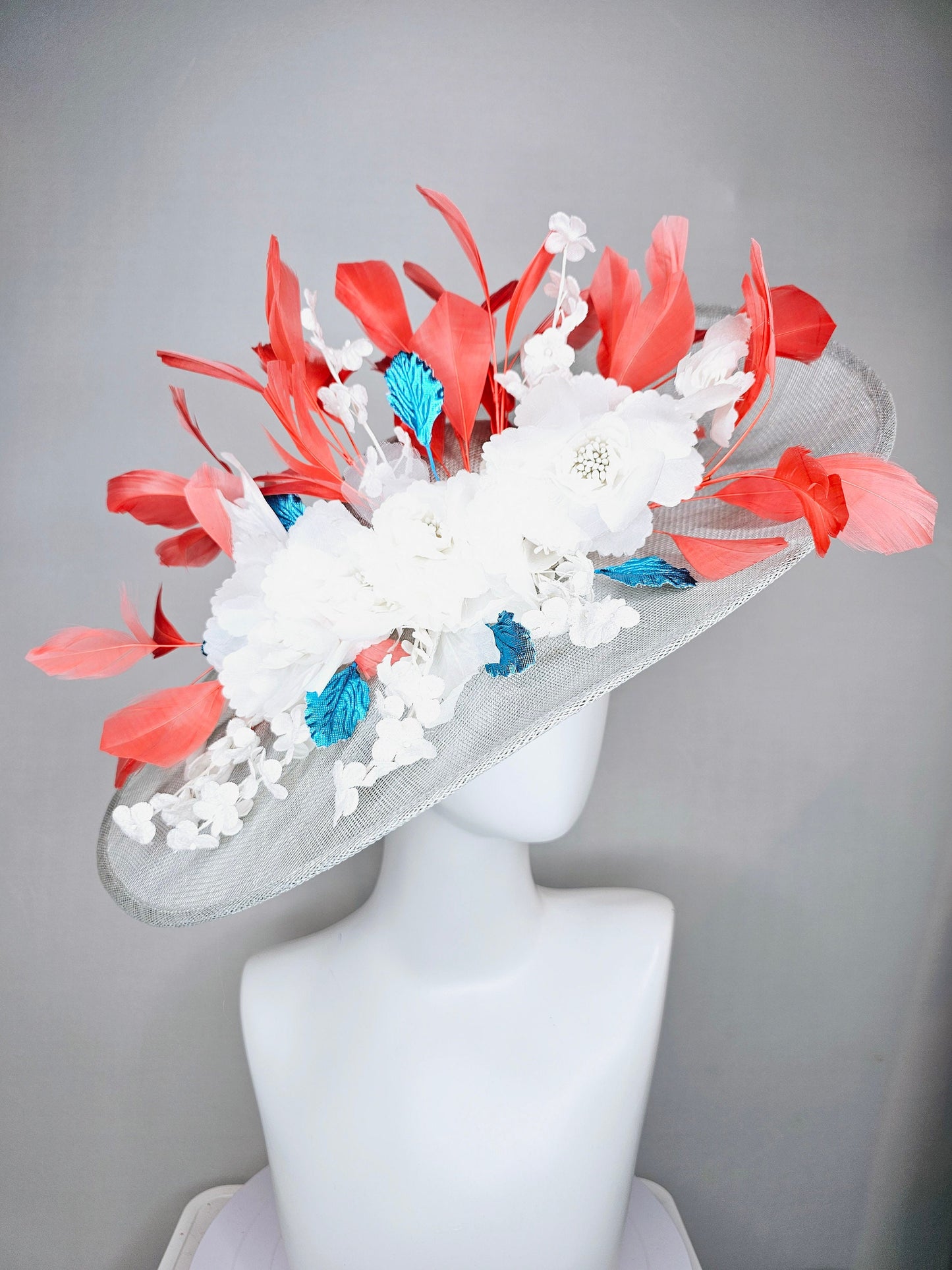 kentucky derby hat large wide brim sinamay gray hat with white ivory organza flowers and blue leaves with coral orange branching feathers