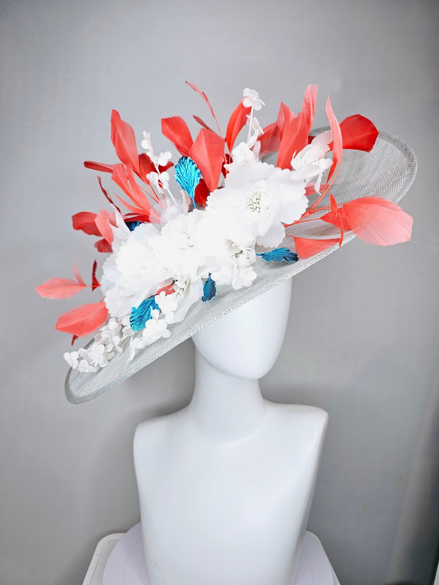 kentucky derby hat large wide brim sinamay gray hat with white ivory organza flowers and blue leaves with coral orange branching feathers