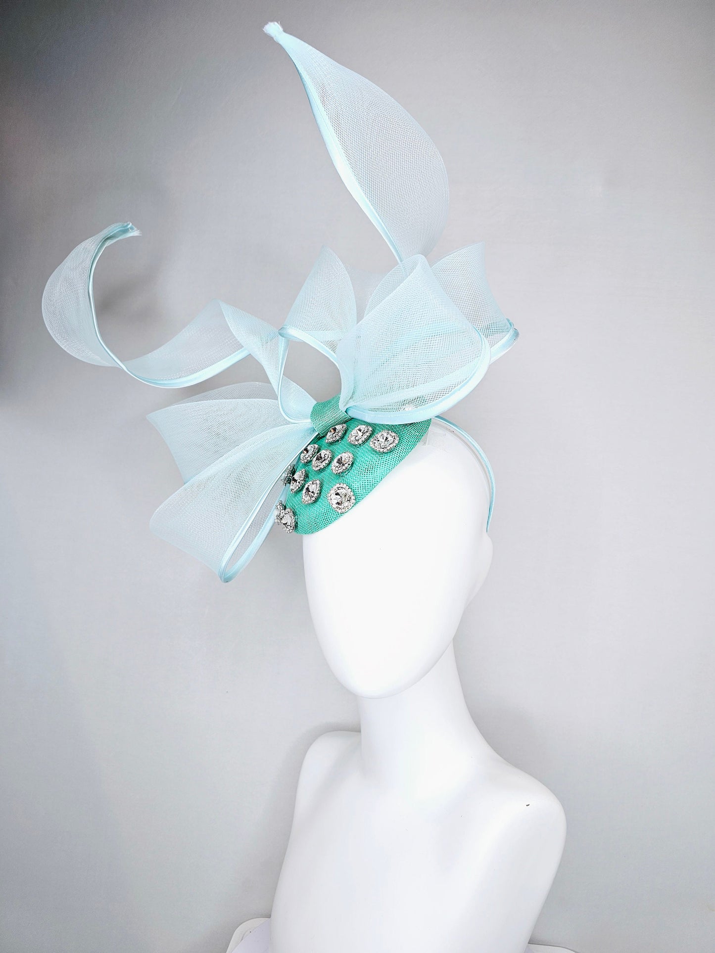 kentucky derby hat fascinator mint green fabric base with mesh and wired ribbon large bendable bow decor with clear  crystal jewels