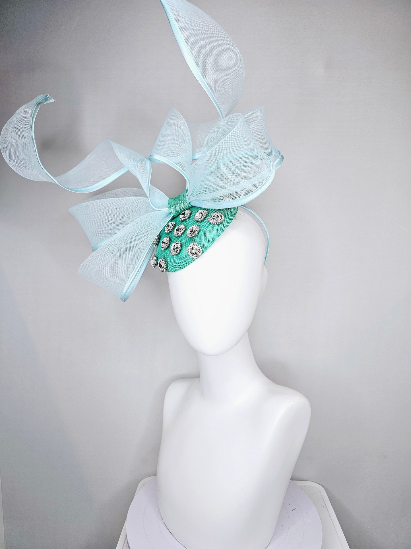 kentucky derby hat fascinator mint green fabric base with mesh and wired ribbon large bendable bow decor with clear  crystal jewels