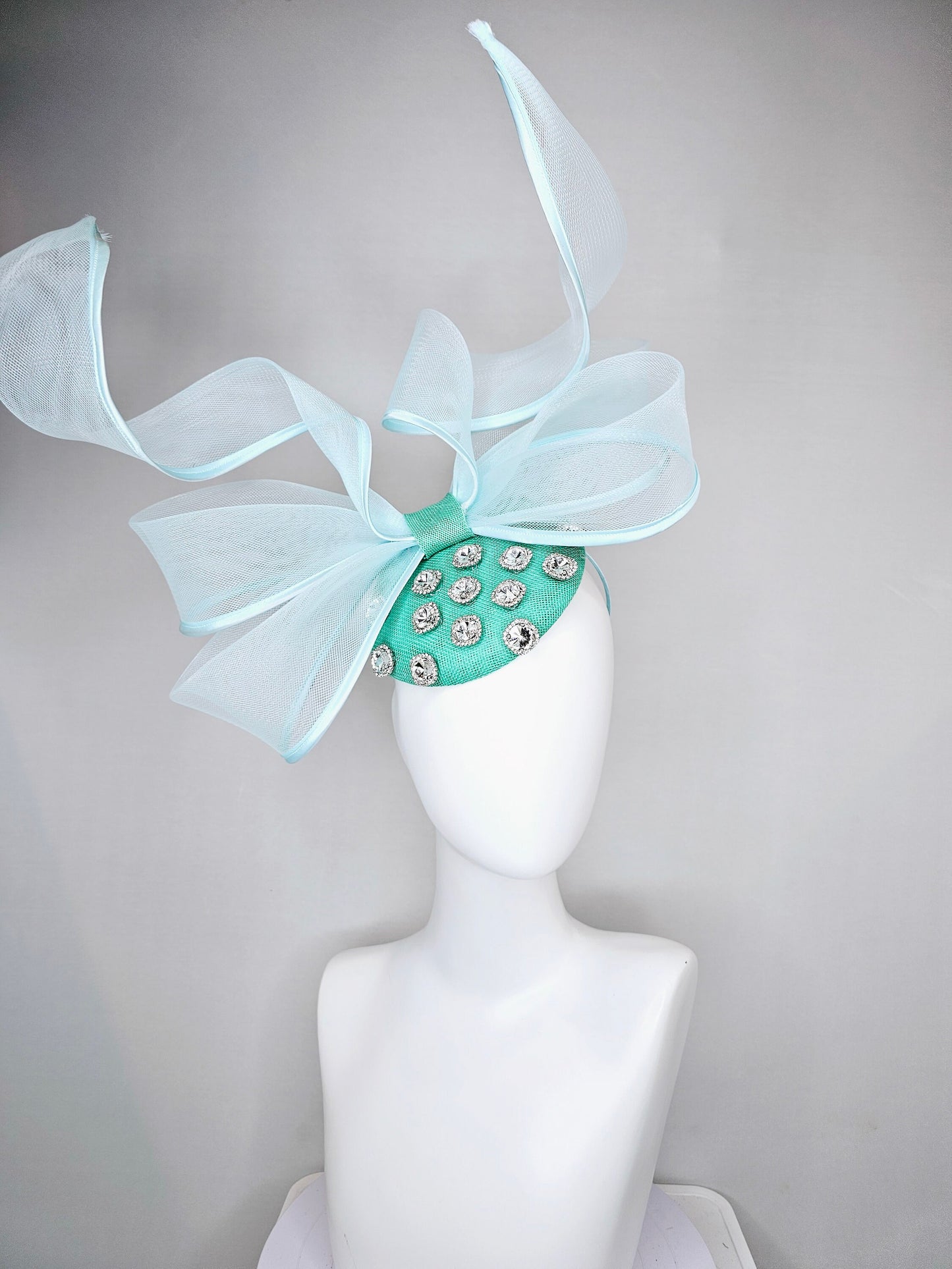 kentucky derby hat fascinator mint green fabric base with mesh and wired ribbon large bendable bow decor with clear  crystal jewels