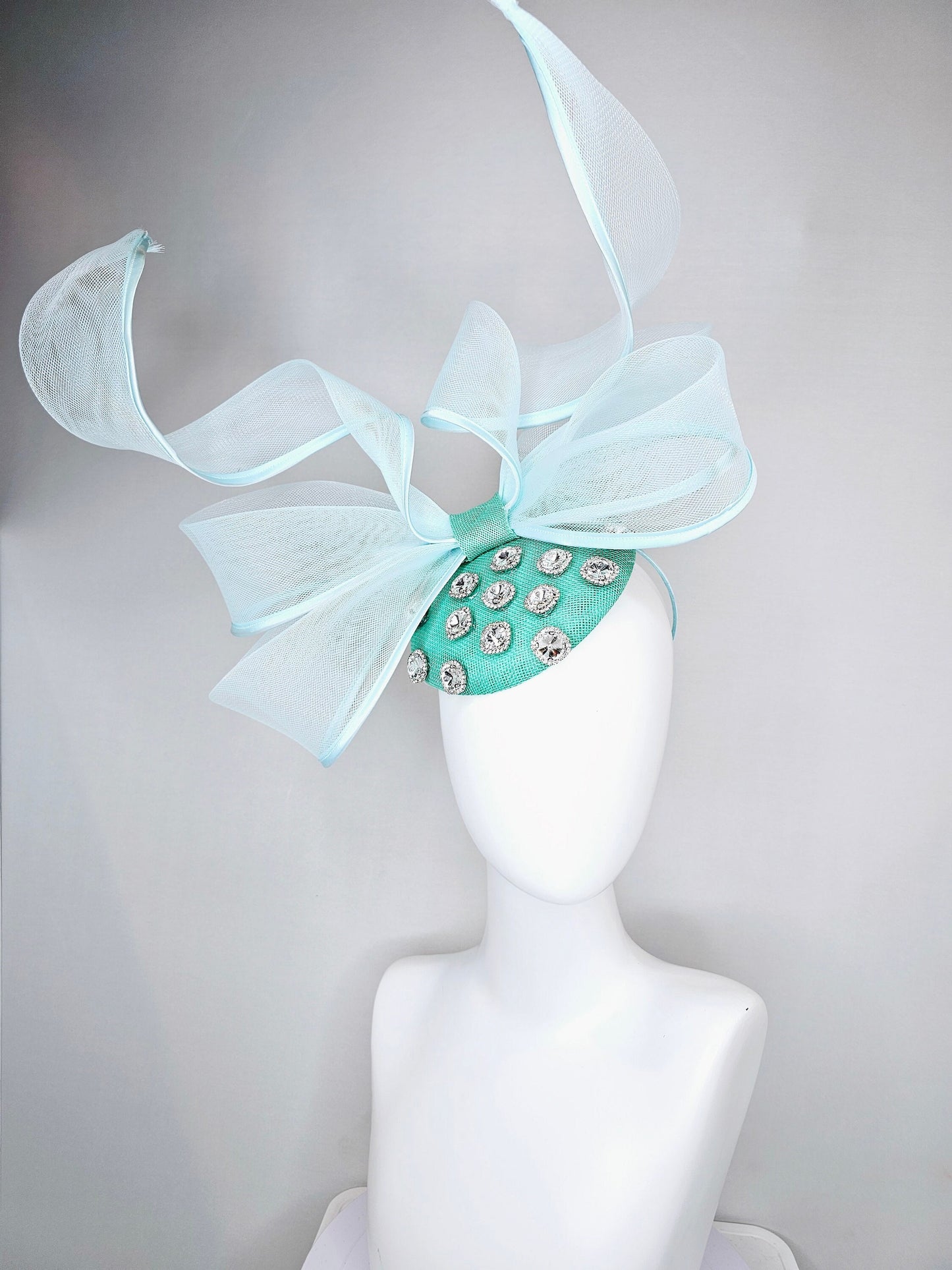 kentucky derby hat fascinator mint green fabric base with mesh and wired ribbon large bendable bow decor with clear  crystal jewels