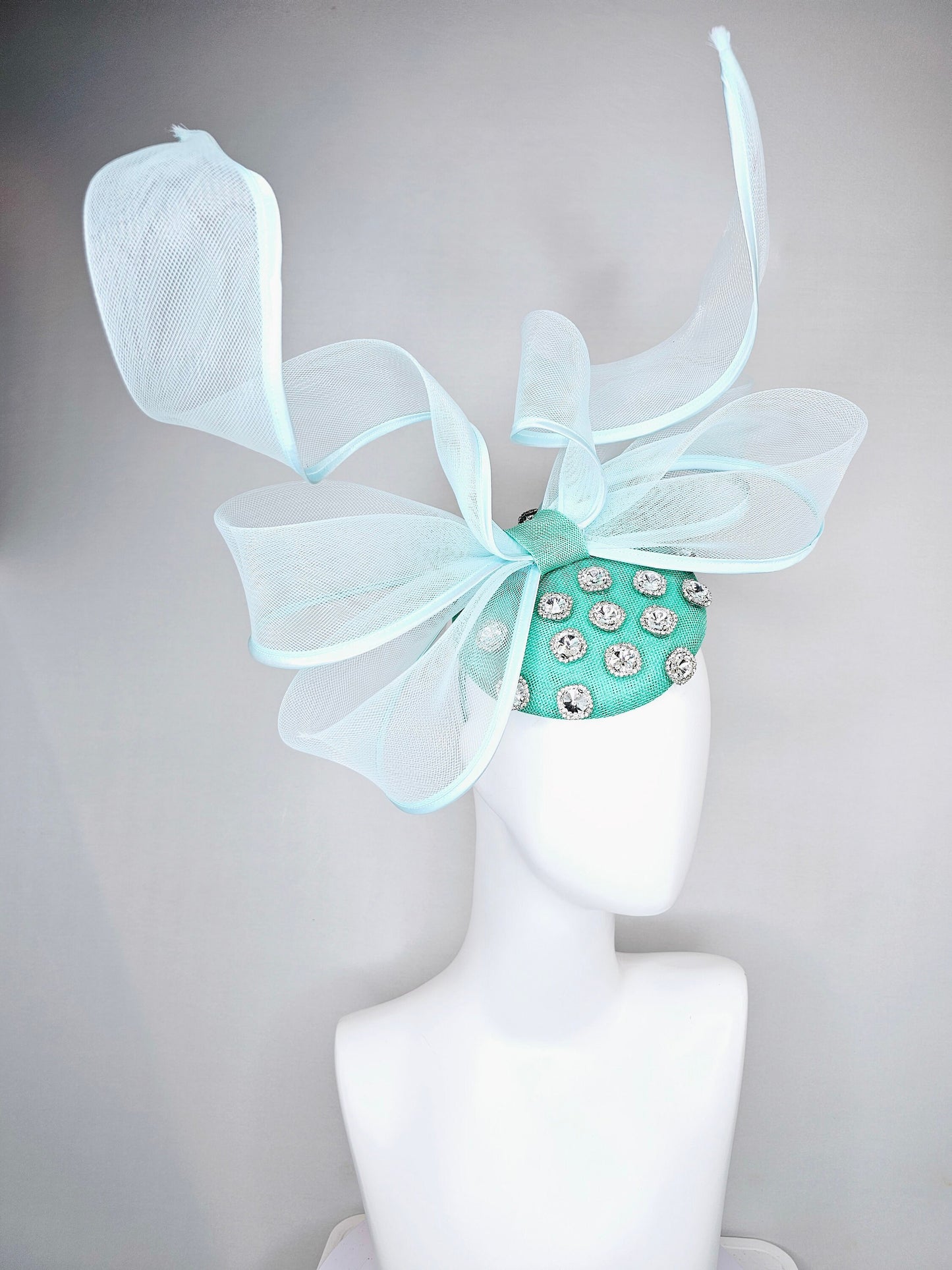 kentucky derby hat fascinator mint green fabric base with mesh and wired ribbon large bendable bow decor with clear  crystal jewels