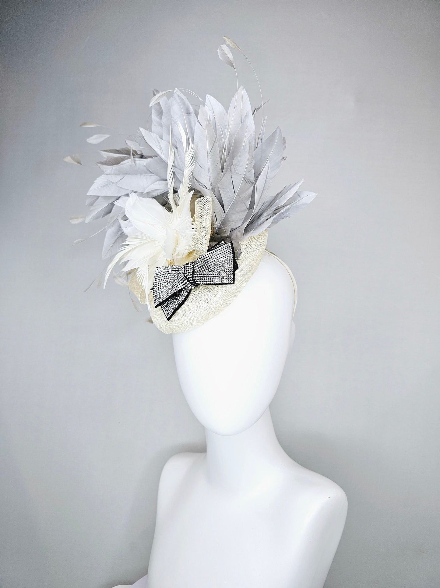 kentucky derby hat fascinator cream white ivory sinamay and feather flower with clear and black crystal bow decor with silver gray feathers