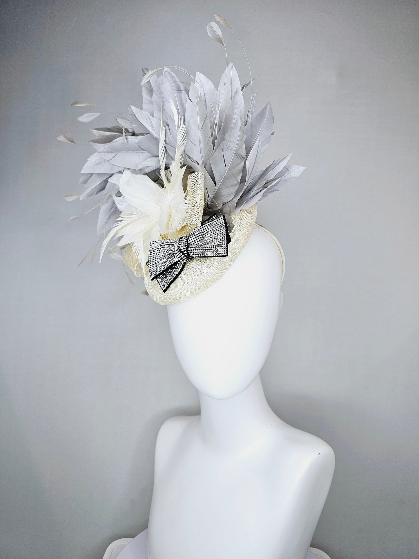 kentucky derby hat fascinator cream white ivory sinamay and feather flower with clear and black crystal bow decor with silver gray feathers