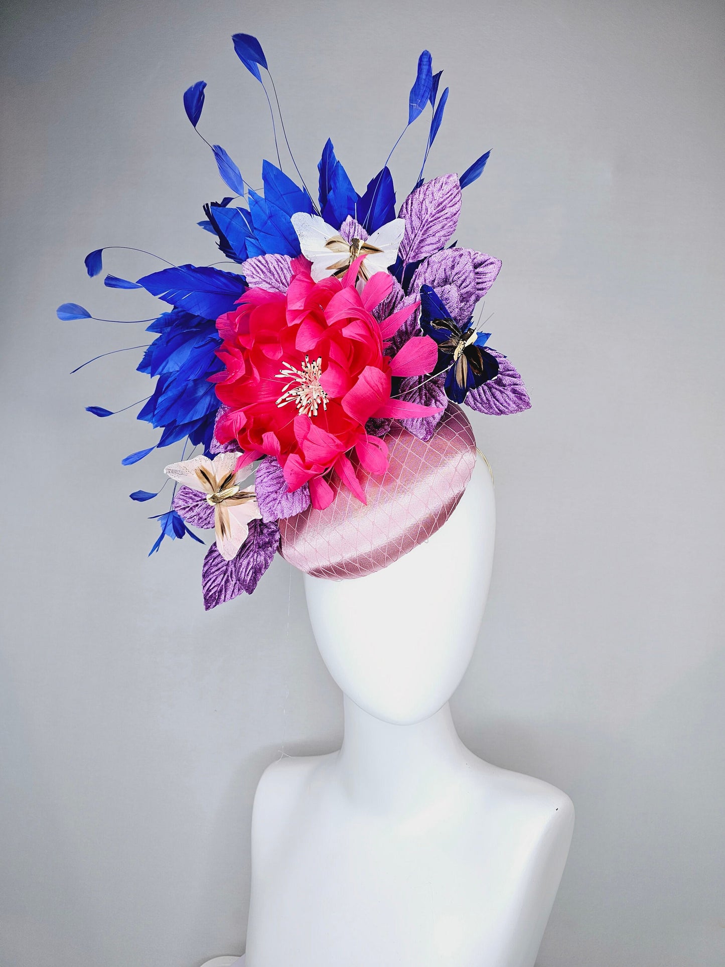 kentucky derby hat fascinator light pink blush satin pink feather flower royal blue feather purple leaves and blue white butterflies