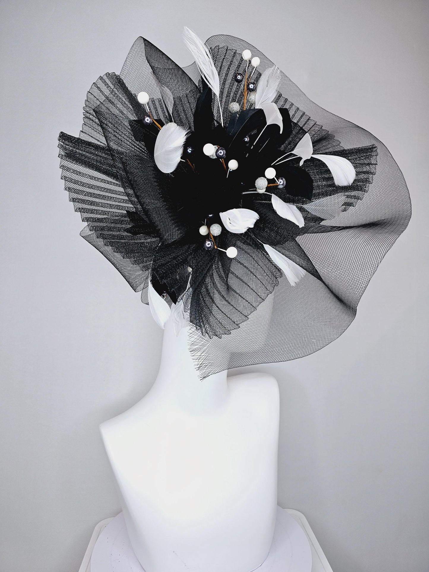 kentucky derby hat fascinator black pleated crinoline pouf with white and black feathers and branching white, sparkly, silver pearls