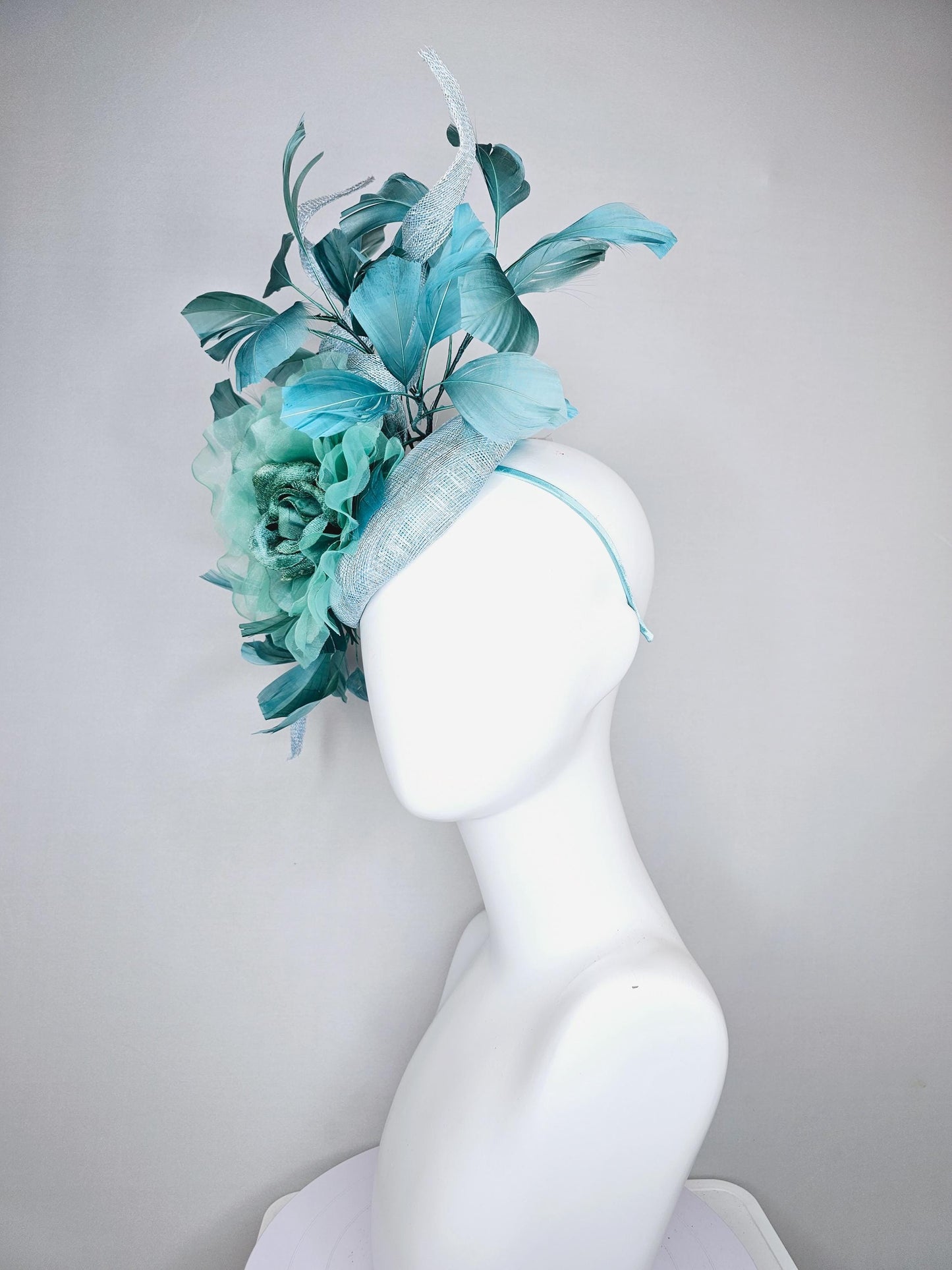 kentucky derby hat fascinator light blue sinamay with mint green large organza satin flower and teal blue branching feathers