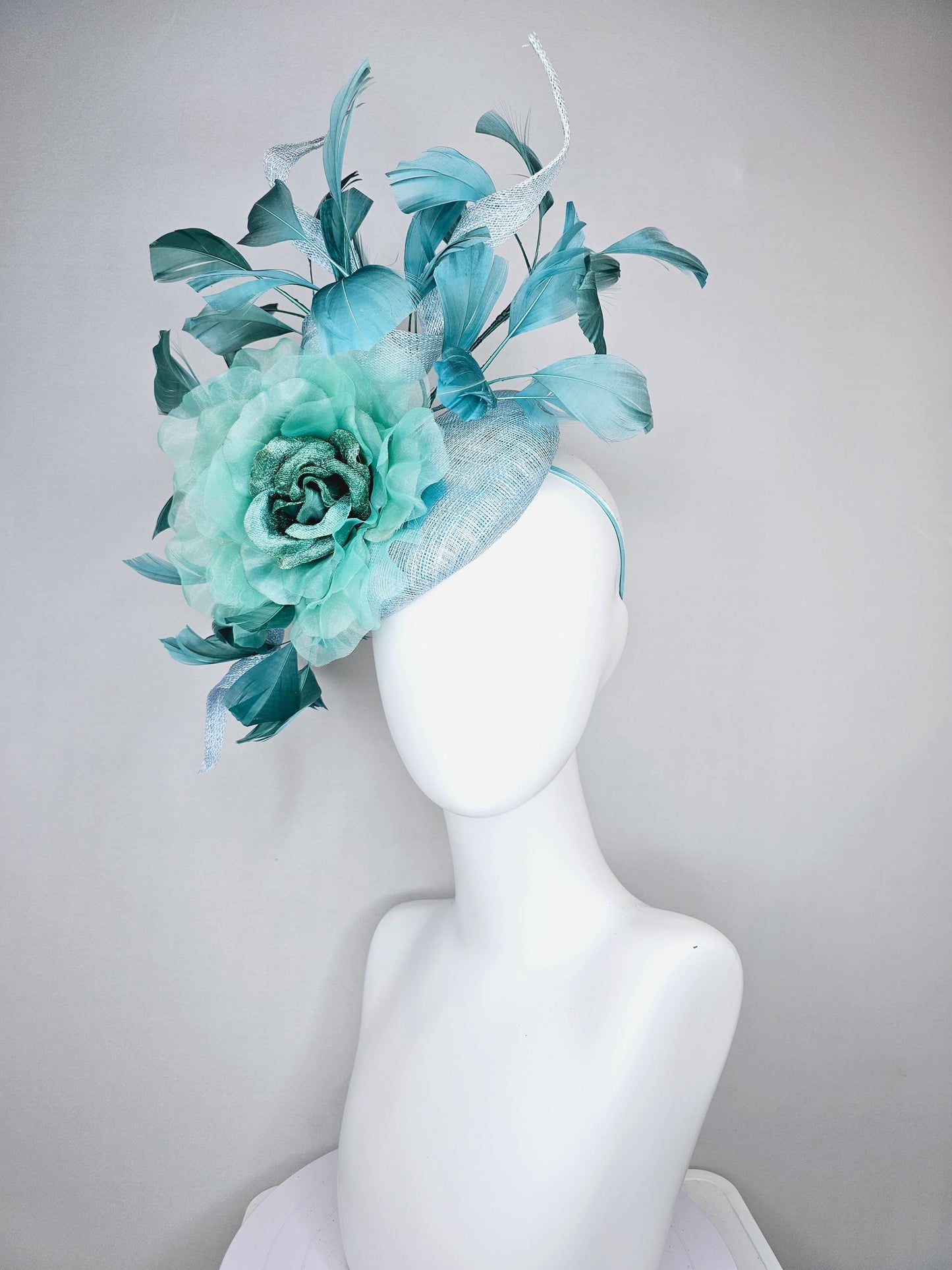 kentucky derby hat fascinator light blue sinamay with mint green large organza satin flower and teal blue branching feathers