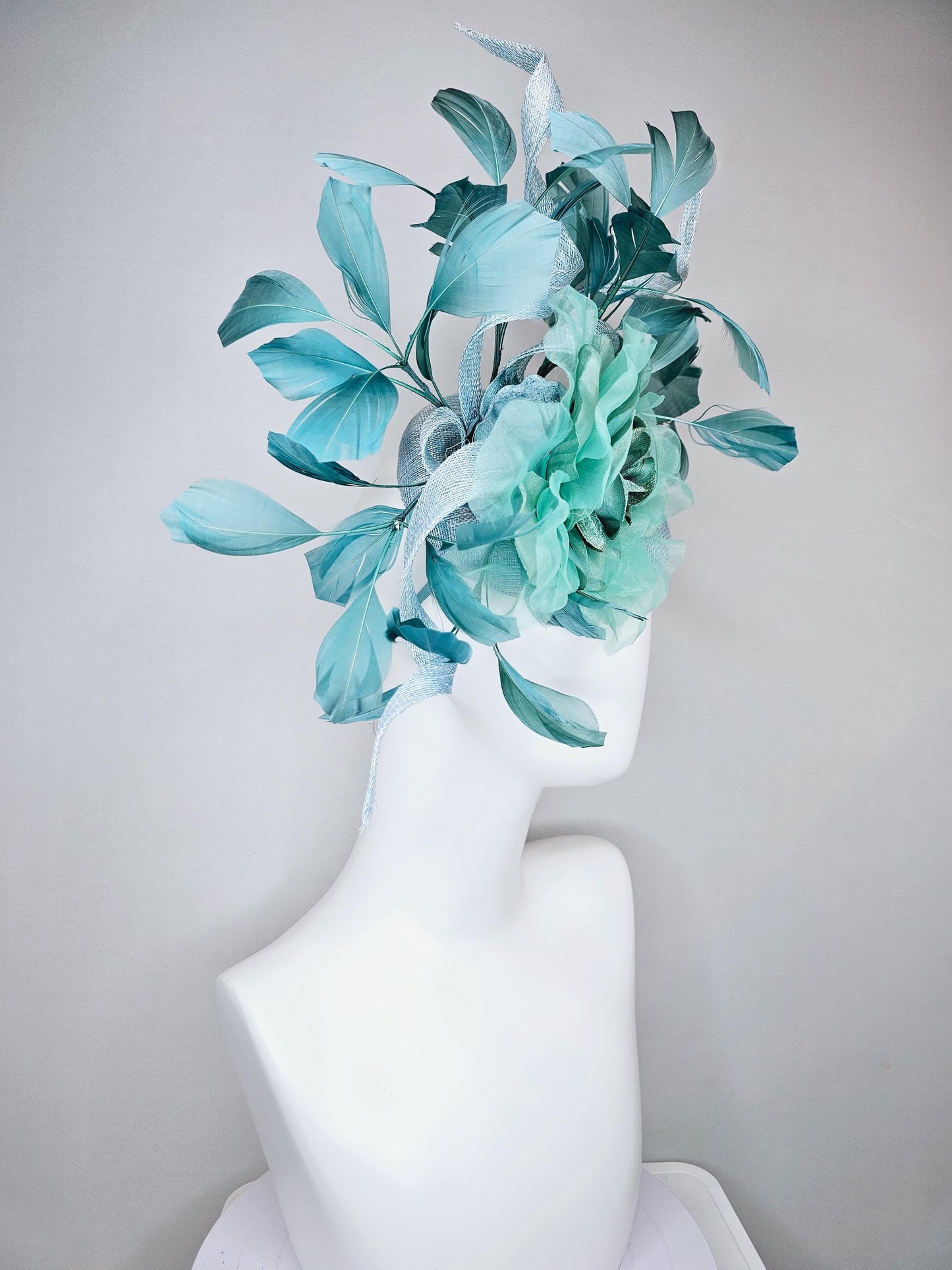 kentucky derby hat fascinator light blue sinamay with mint green large organza satin flower and teal blue branching feathers