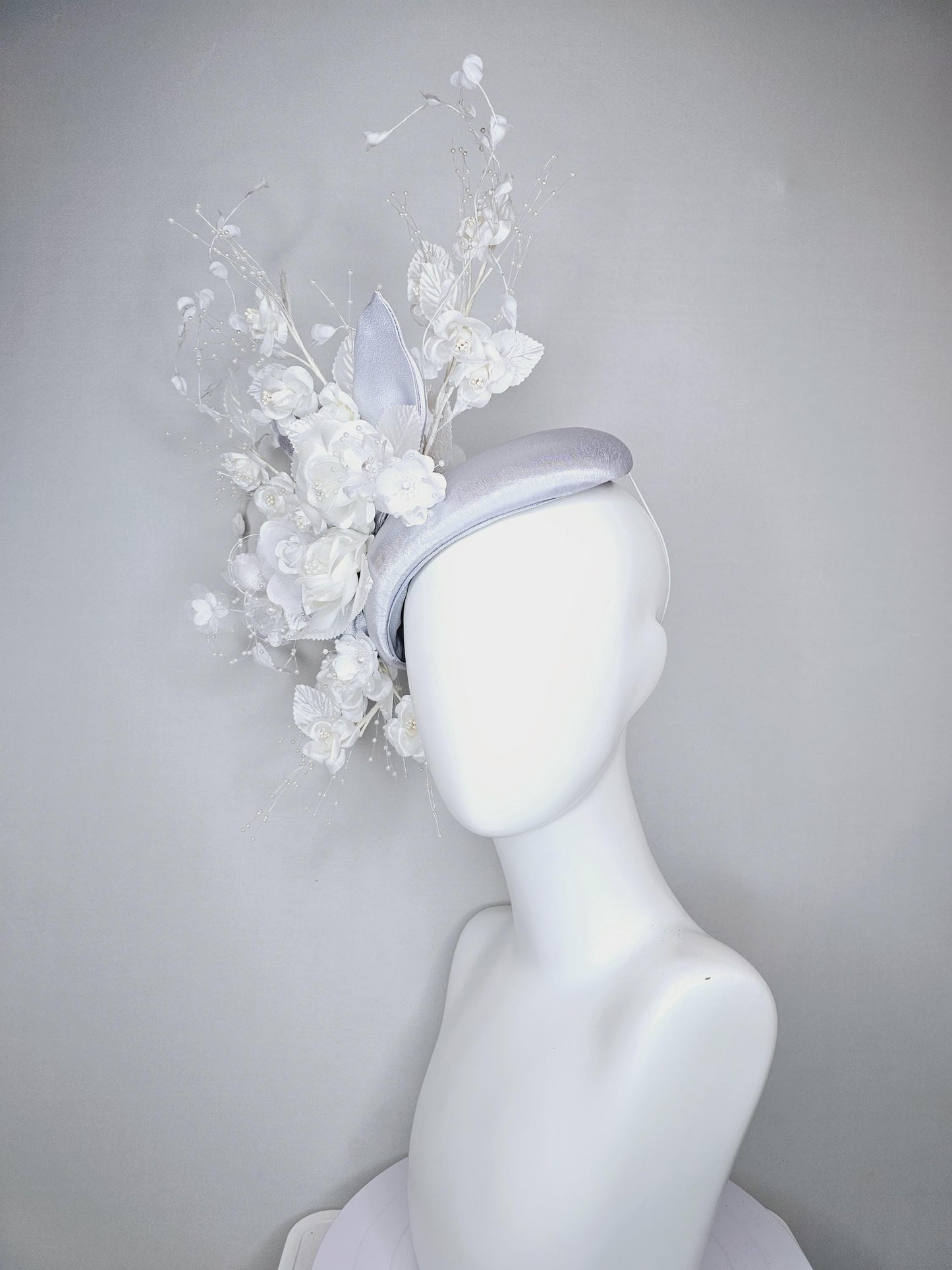 kentucky derby hat fascinator silver gray satin with ivory white satin flowers, white velvet leaves with decorative pearl strings