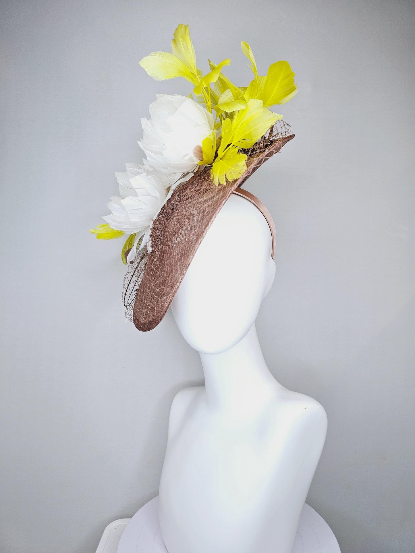 kentucky derby hat fascinator taupe brown sinamay saucer with netting, white fluffy feather flowers and yellow branching feathers