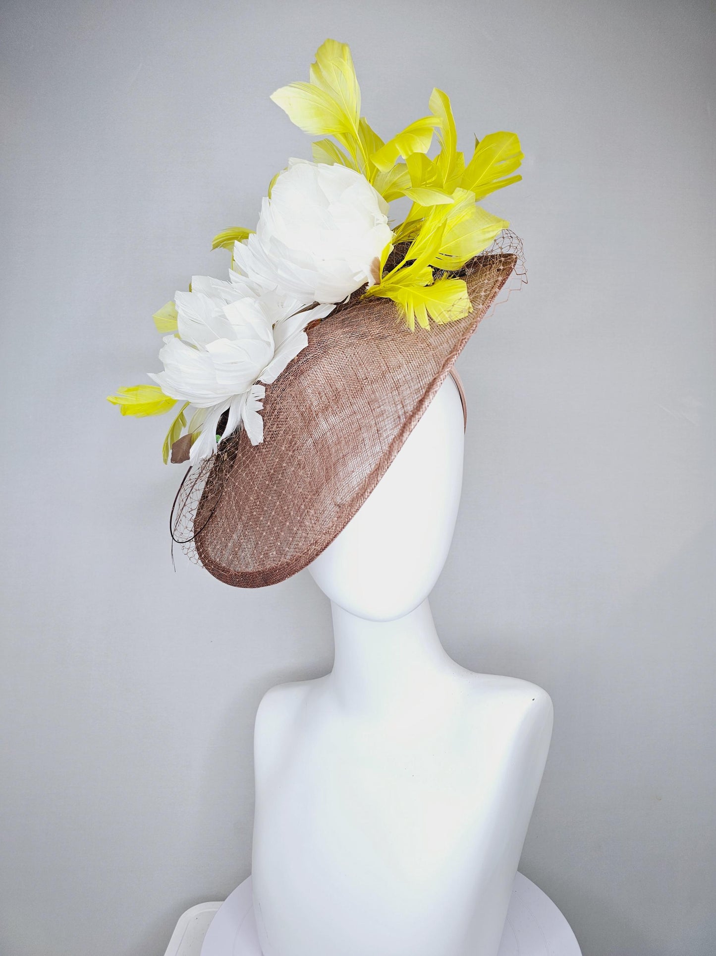 kentucky derby hat fascinator taupe brown sinamay saucer with netting, white fluffy feather flowers and yellow branching feathers