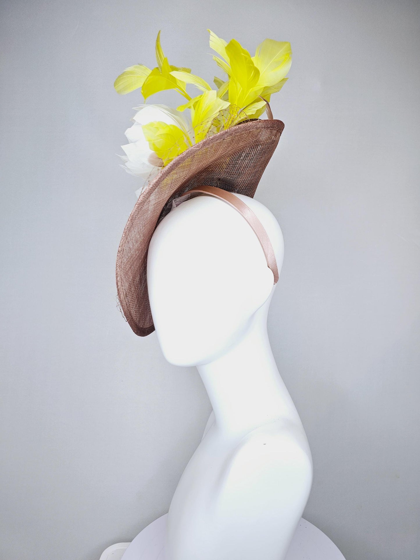 kentucky derby hat fascinator taupe brown sinamay saucer with netting, white fluffy feather flowers and yellow branching feathers