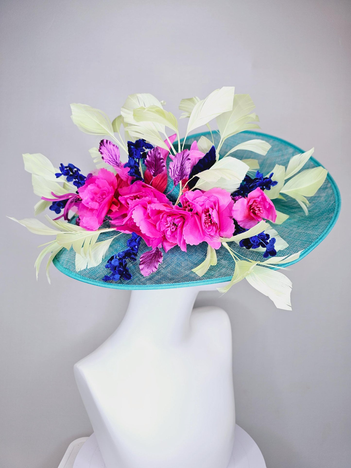 kentucky derby hat large wide brim sinamay turquoise blue hat hot pink silk flowers,mint green feathers,purple leaves navy blue flower stems