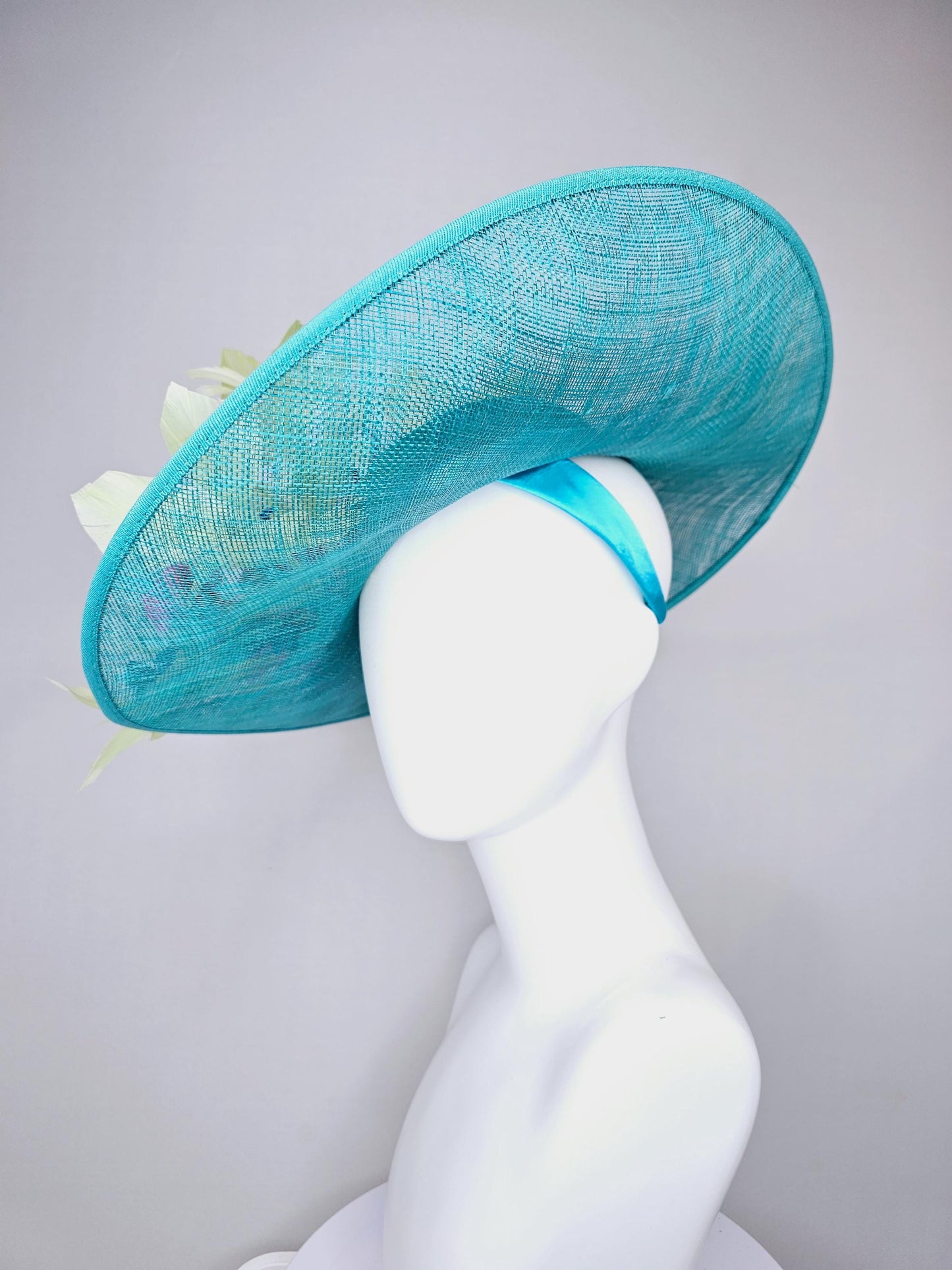 kentucky derby hat large wide brim sinamay turquoise blue hat hot pink silk flowers,mint green feathers,purple leaves navy blue flower stems