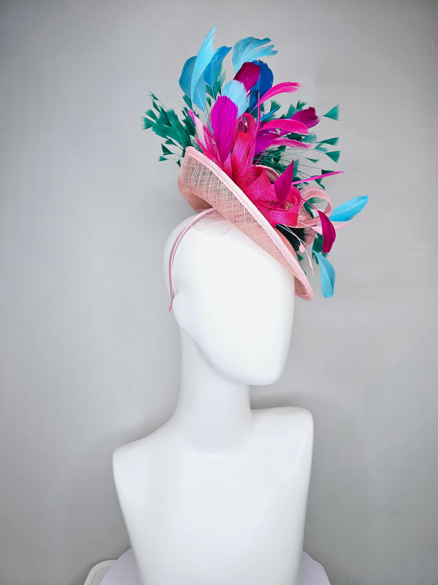 kentucky derby hat fascinator light pink sinamay saucer with curls and with colorful bright fuchsia hot pink,green, blue branching feathers