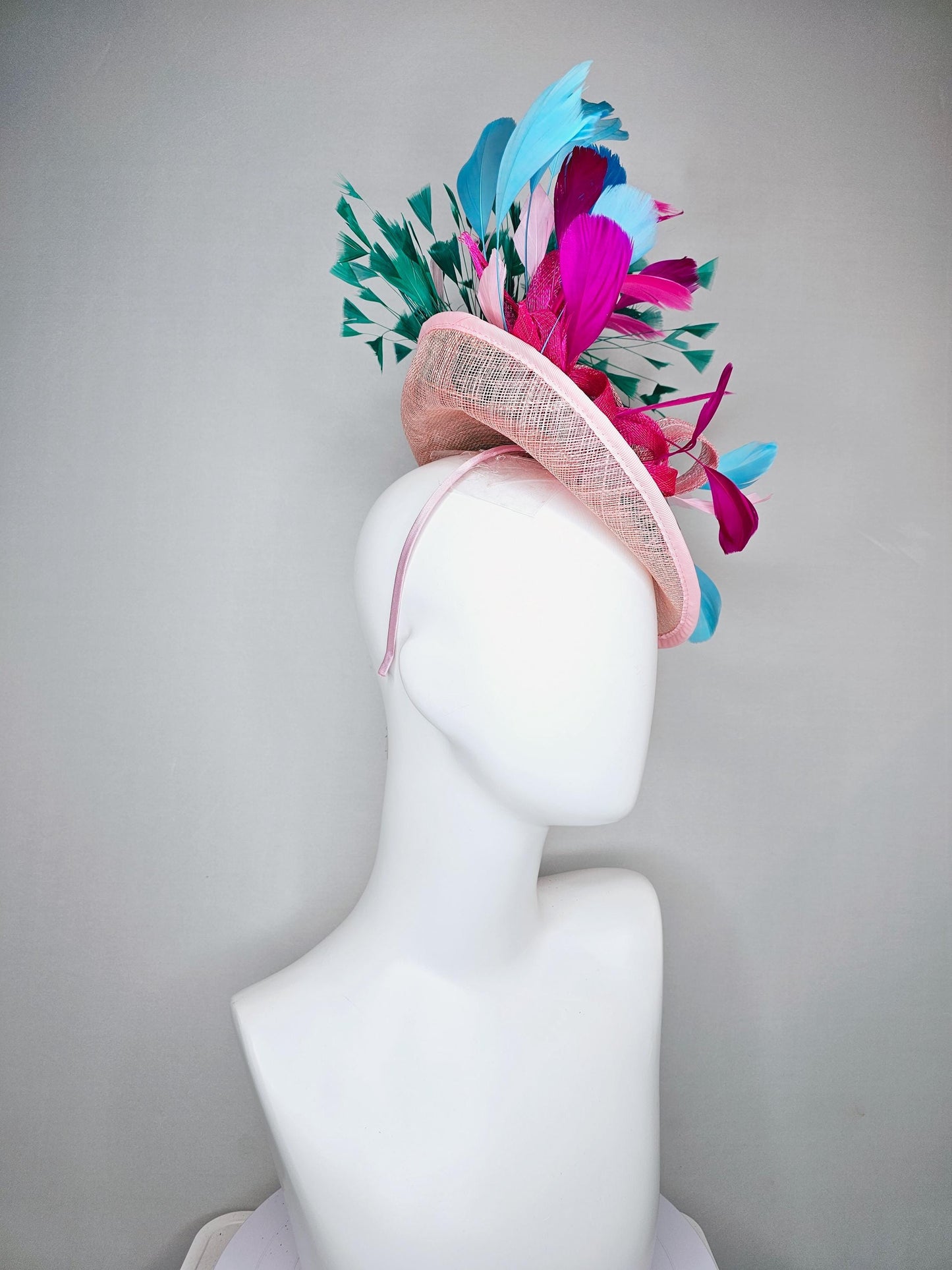 kentucky derby hat fascinator light pink sinamay saucer with curls and with colorful bright fuchsia hot pink,green, blue branching feathers