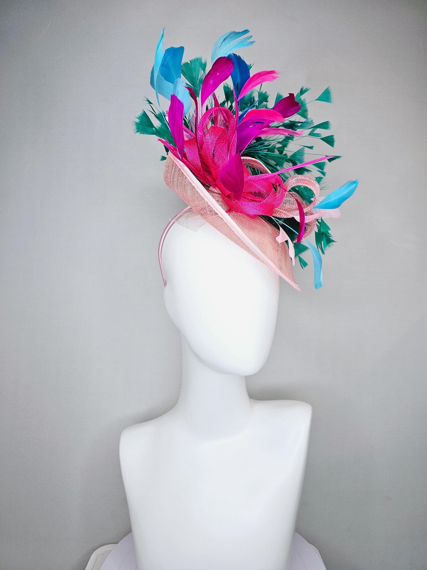 kentucky derby hat fascinator light pink sinamay saucer with curls and with colorful bright fuchsia hot pink,green, blue branching feathers