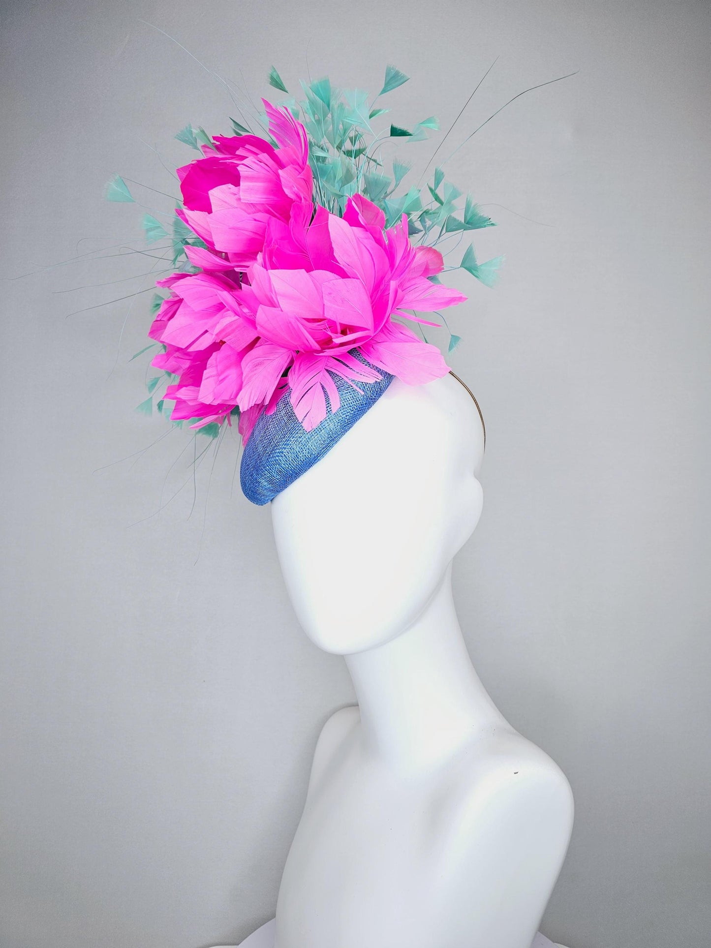 kentucky derby hat fascinator blue sinamay saucer with bright fuchsia hot pink feather flowers and mint green branching feathers