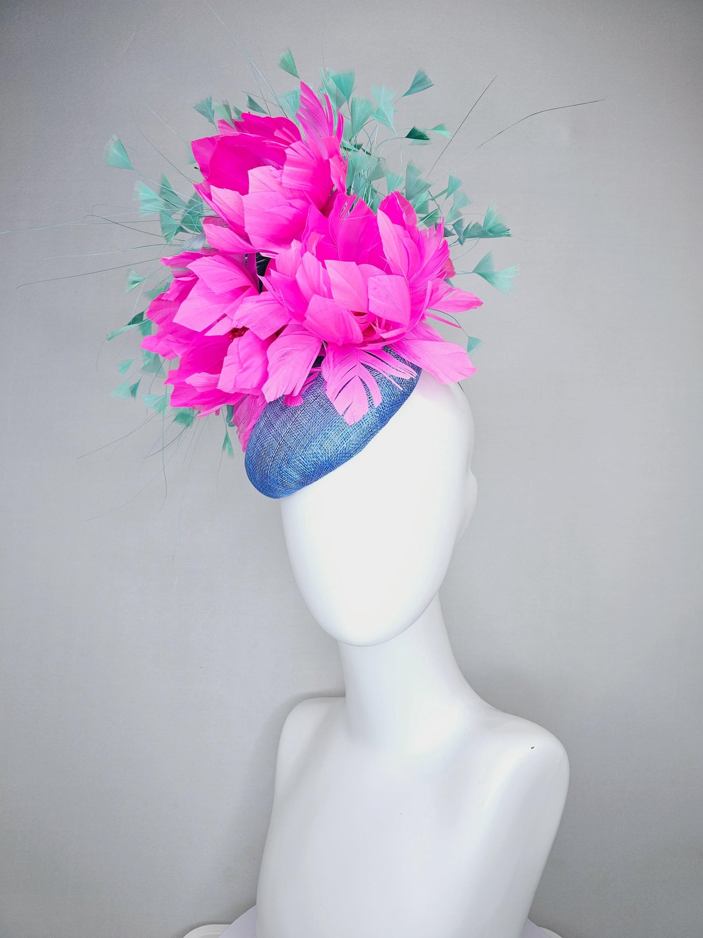 kentucky derby hat fascinator blue sinamay saucer with bright fuchsia hot pink feather flowers and mint green branching feathers