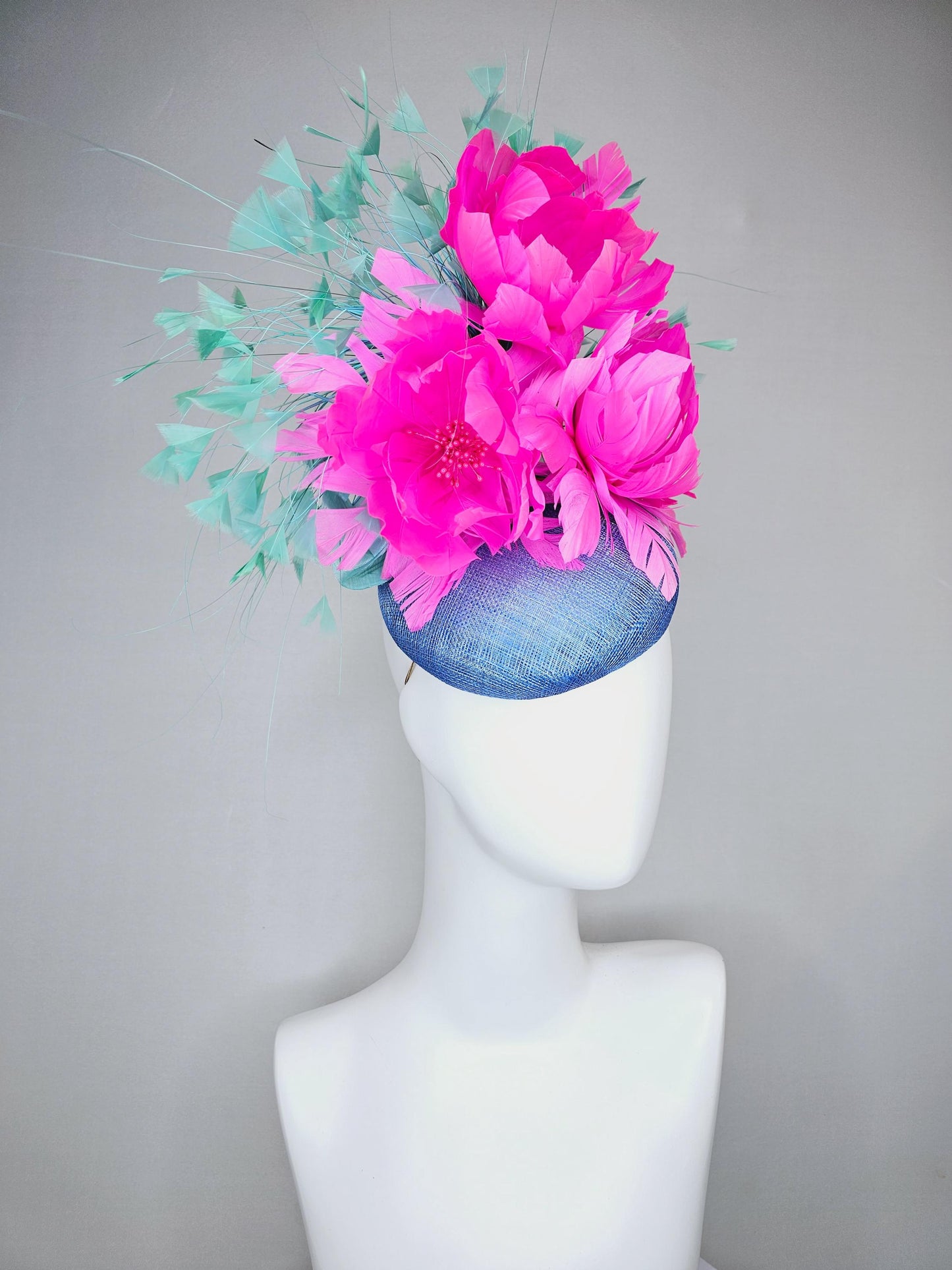 kentucky derby hat fascinator blue sinamay saucer with bright fuchsia hot pink feather flowers and mint green branching feathers