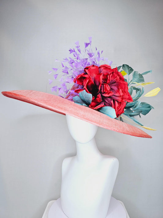 kentucky derby hat large wide brim sinamay coral orange hat with large red satin silk flower with purple,teal blue,yellow branching feathers