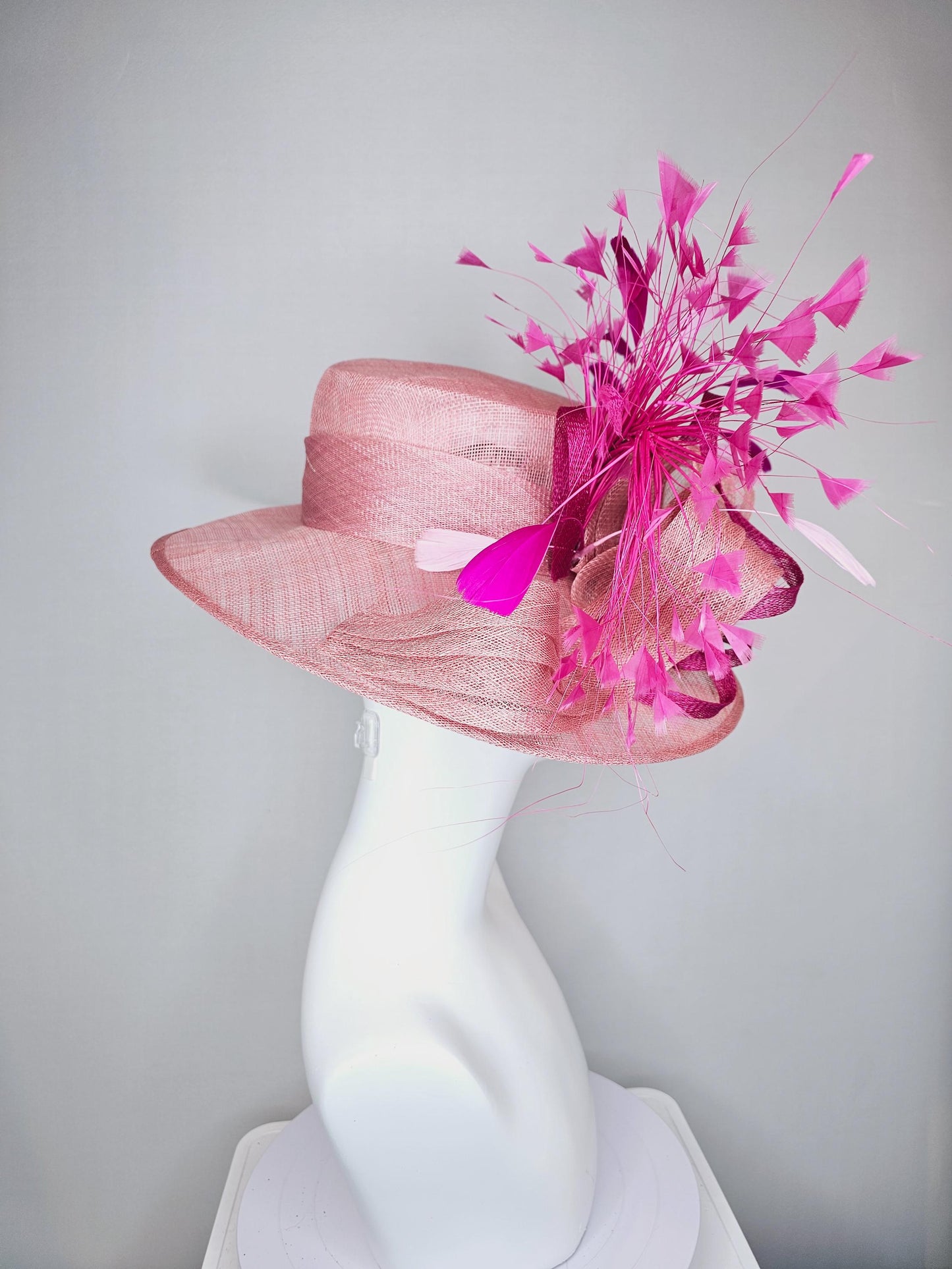 kentucky derby hat large wide brim sinamay light blush pink hat with fuchsia hot pink purple branching feathers and sinamay curls