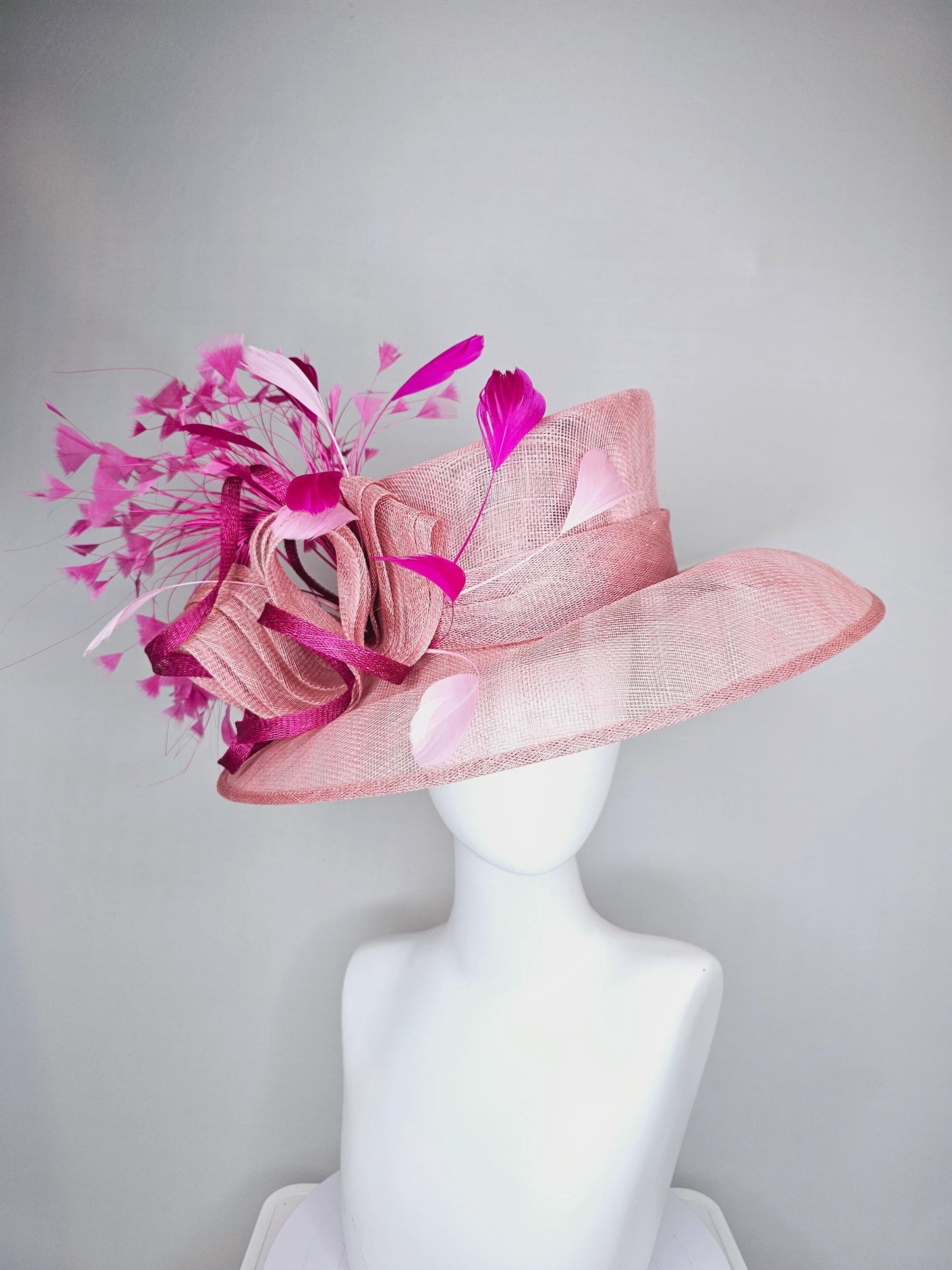 kentucky derby hat large wide brim sinamay light blush pink hat with fuchsia hot pink purple branching feathers and sinamay curls