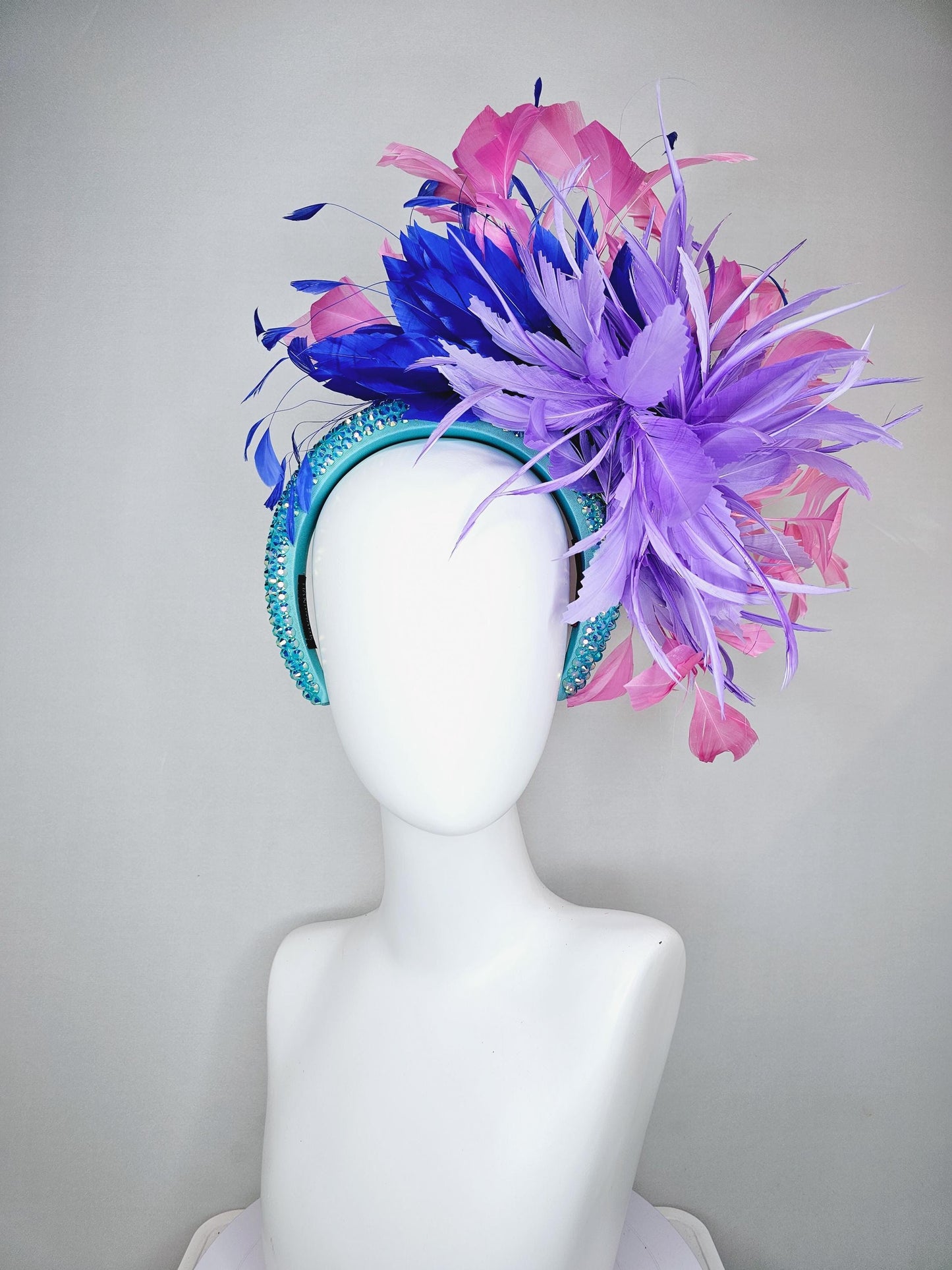 kentucky derby hat fascinator branching pink,royal blue,and purple lavender feathers on iridescent Swarovski crystal turquoise blue headband