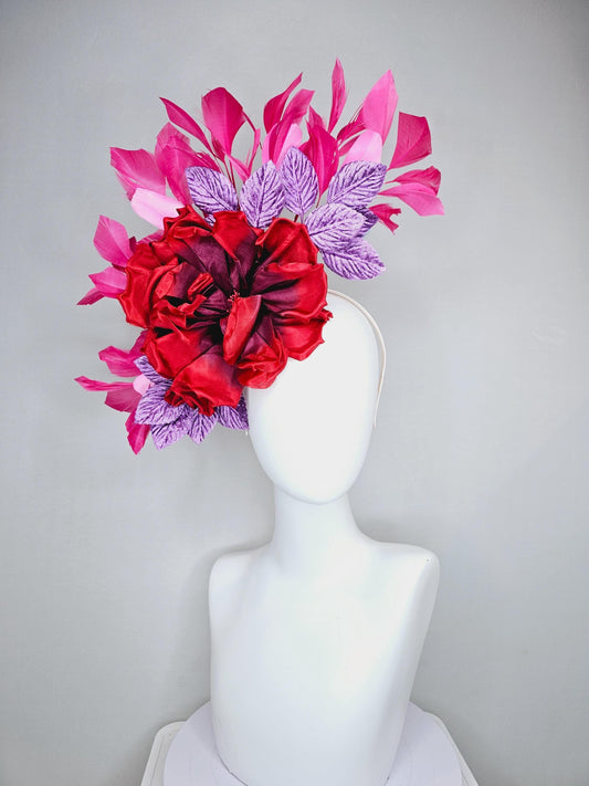 kentucky derby hat fascinator with large red satin silk flower with purple lavender velvet leaves,and branching pink feathers