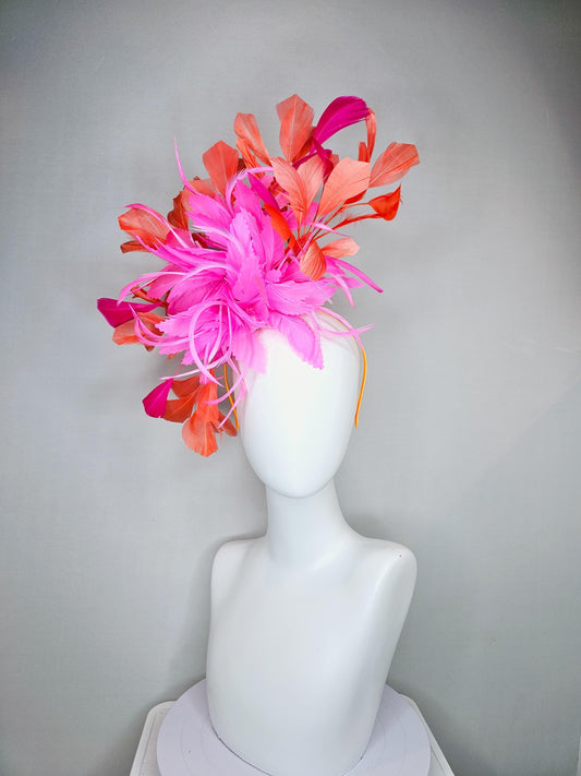 kentucky derby hat fascinator with bright pink feather flowers, fuchsia pink and orange coral branching feathers