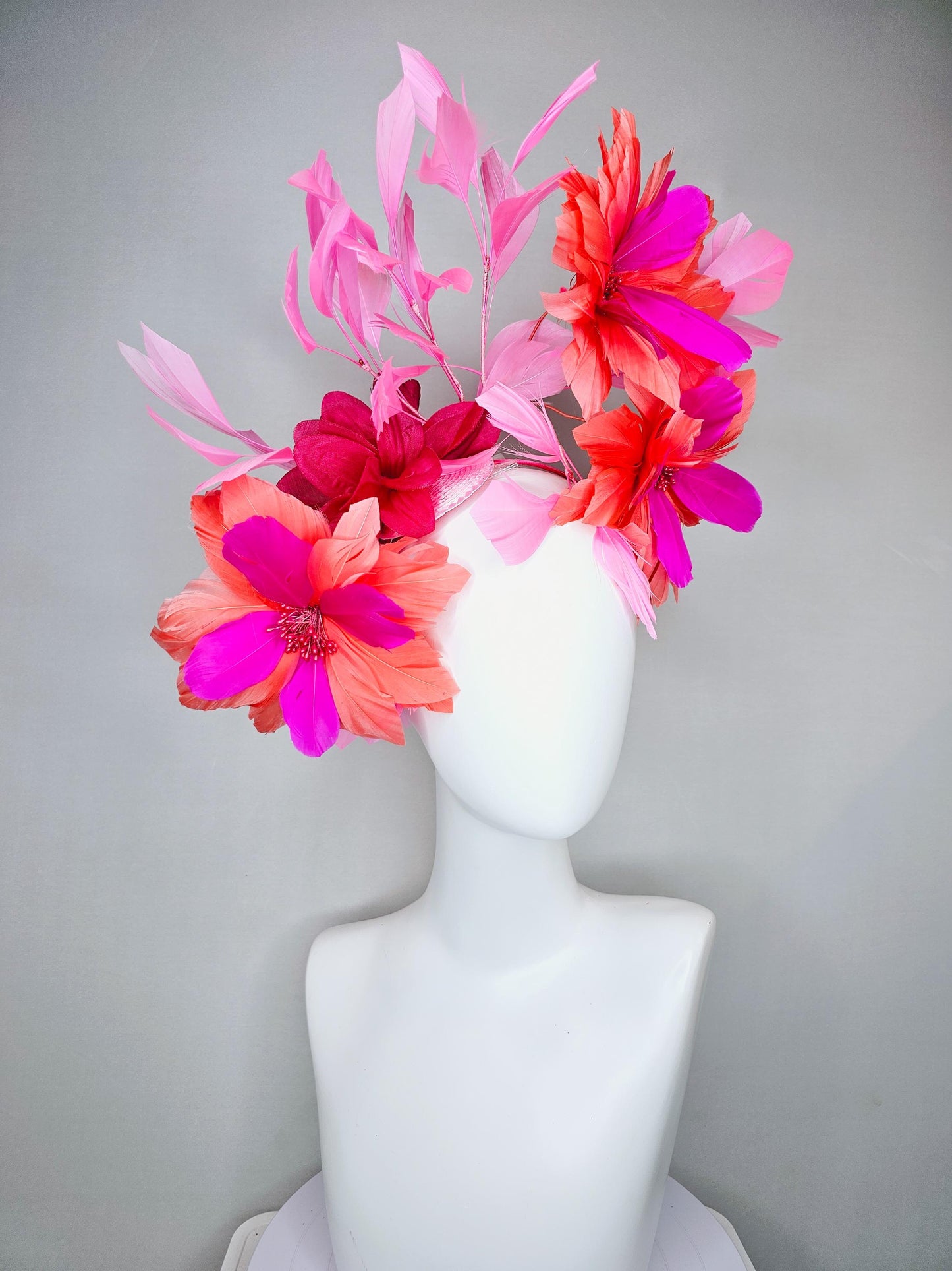 kentucky derby hat fascinator with fuchsia pink and coral orange feather flowers,and light pink branching feathers