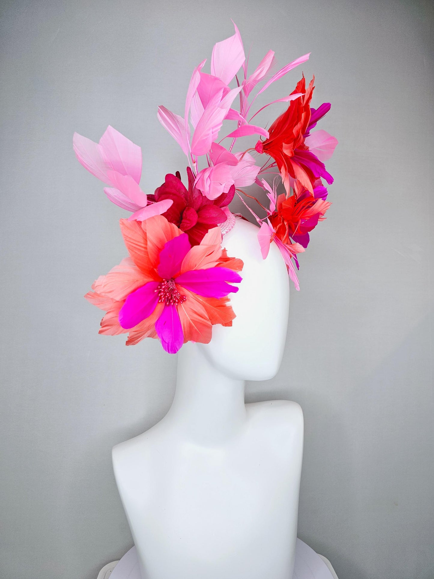 kentucky derby hat fascinator with fuchsia pink and coral orange feather flowers,and light pink branching feathers