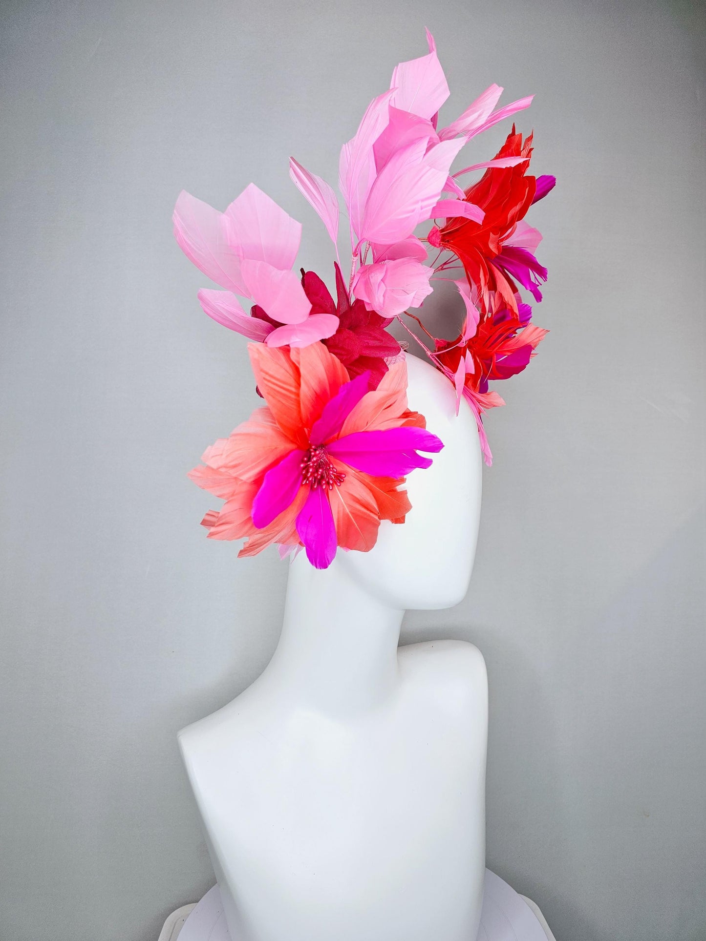 kentucky derby hat fascinator with fuchsia pink and coral orange feather flowers,and light pink branching feathers